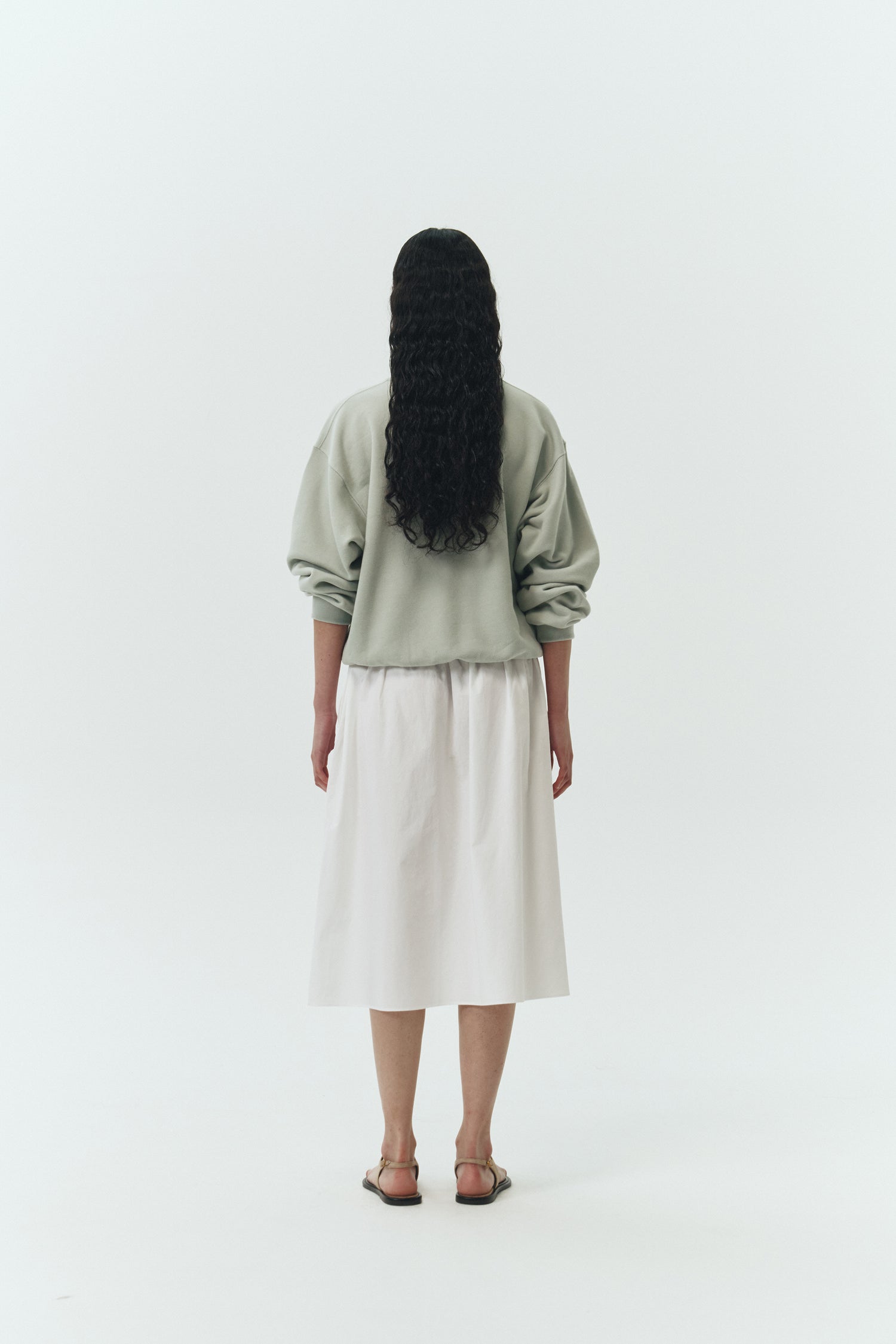 Maryam Skirt in sky, a midi cotton skirt with shirred waistband, drawstring detail, side pockets, and a softly flared silhouette
