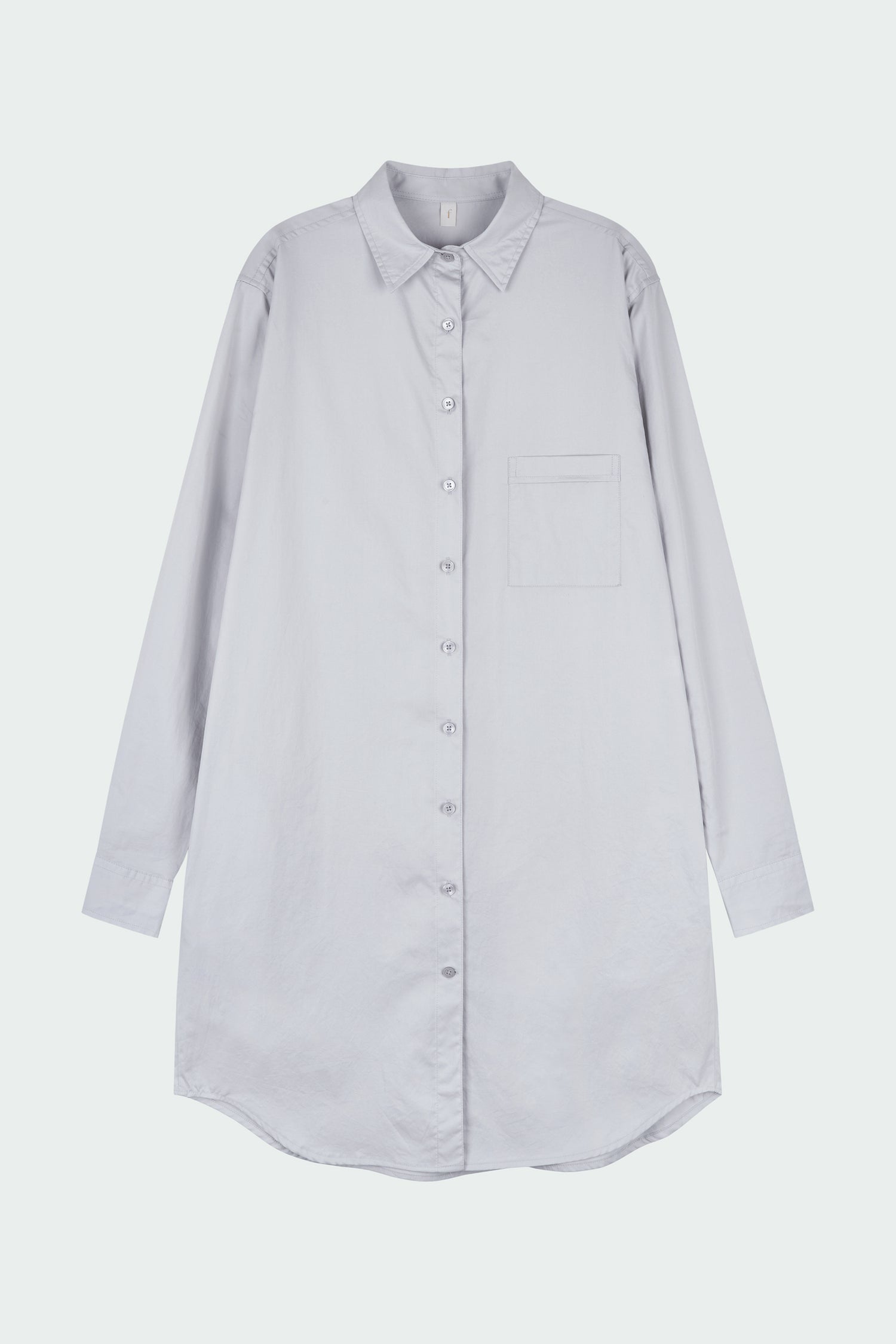 Cara Dress in cloud gray, long sleeve cotton shirt dress with front chest pocket, curved hem, hidden side pockets, and a relaxed silhouette.
