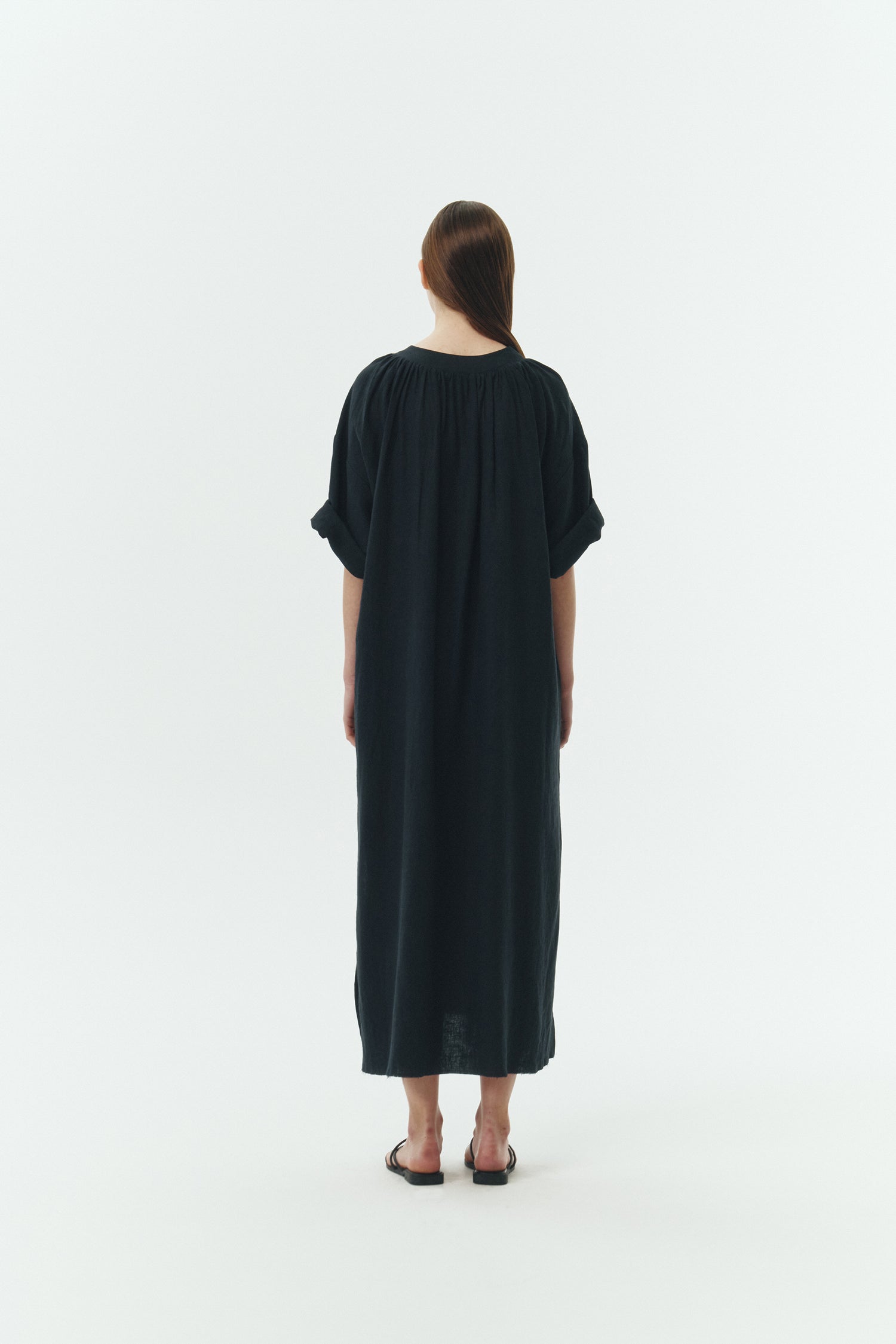 Charlotte Dress in navy, V-neck summer maxi dress in a lightweight linen-rayon blend with drop shoulders, hidden side pockets, raw edge hem, and a relaxed fit.