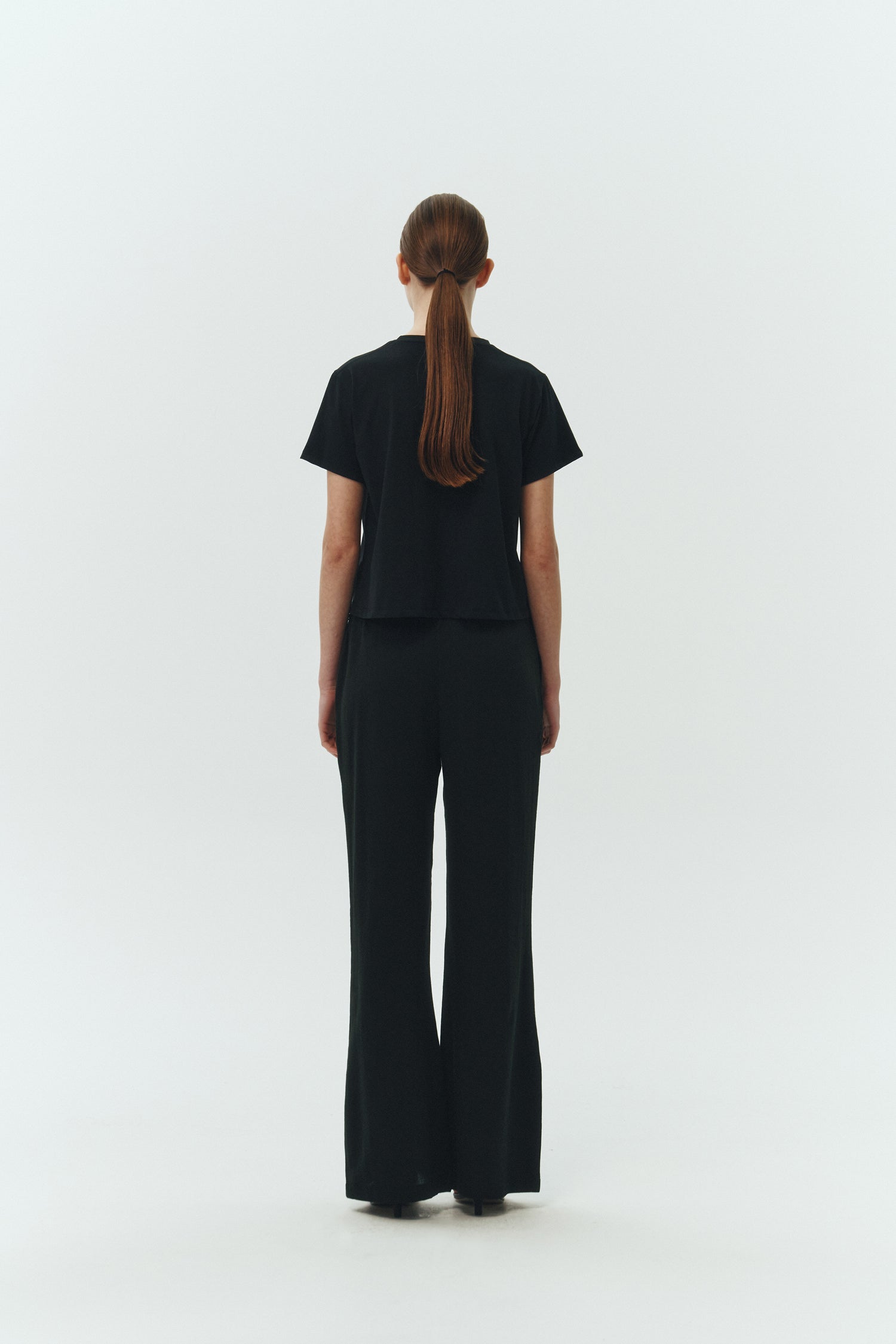 Ivy T-shirt in black, cropped short-sleeve tee in a lightweight cotton-poly blend with crew neck, regular fit, and clean silhouette.
