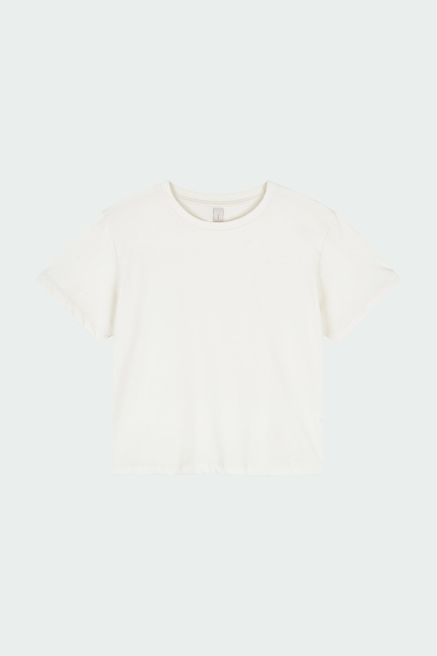 Ivy T-shirt in ivory, cropped short-sleeve tee in a lightweight cotton-poly blend with crew neck, regular fit, and clean silhouette.