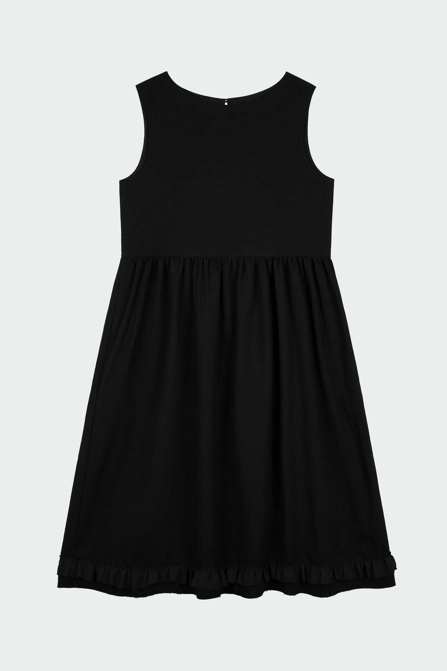Pina Dress in black, sleeveless cotton midi dress with shirring at waist and hem, hidden side pockets, and an open back with button closure.