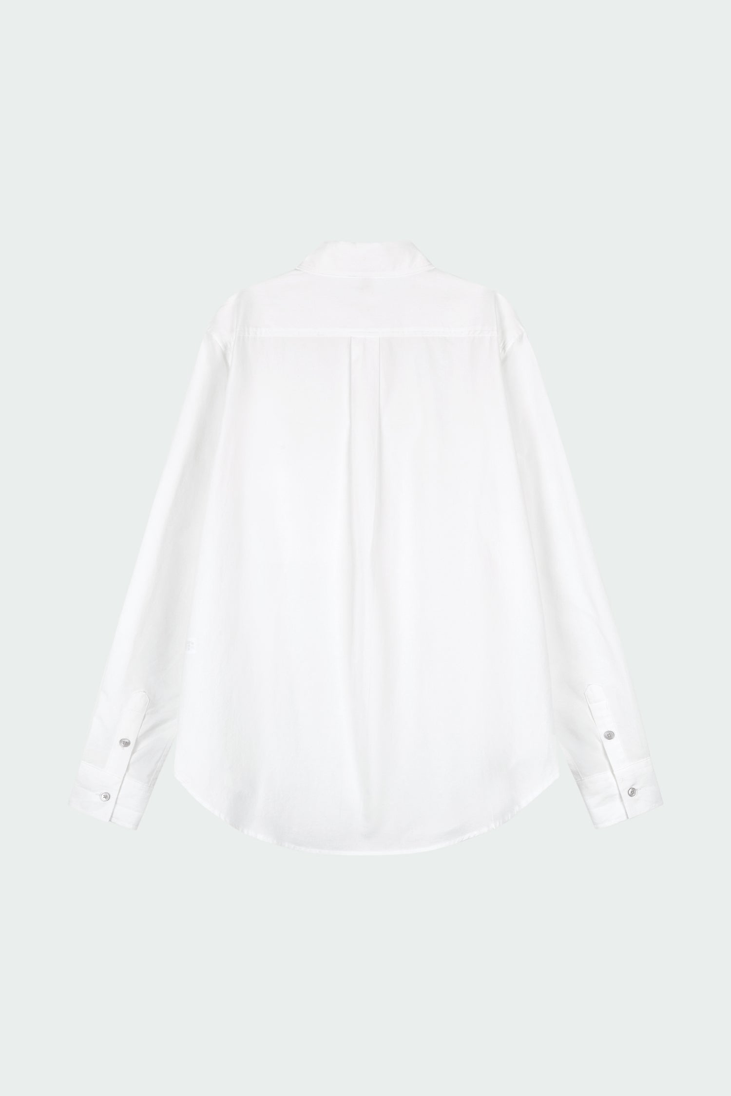 Isabella Shirt in white, a lightweight cotton-poly blend button-up with chest pocket, back pleat, and buttoned cuffs, designed in a regular fit with a hip-length silhouette