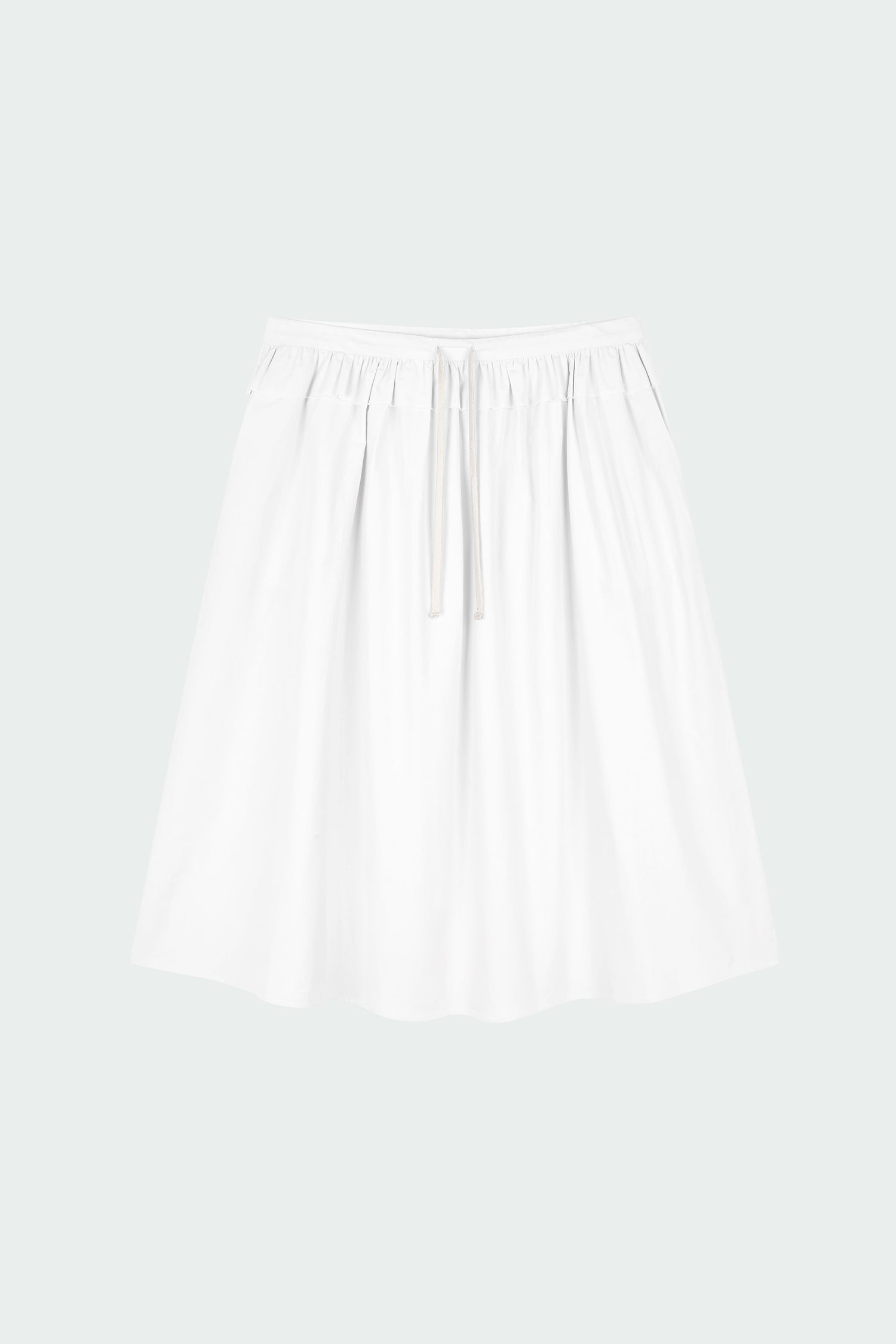 Maryam Skirt in sky, a midi cotton skirt with shirred waistband, drawstring detail, side pockets, and a softly flared silhouette