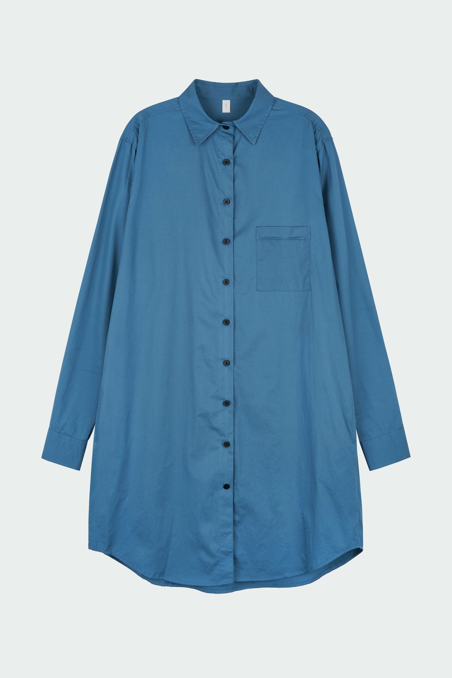 Cara Dress in blue green, long sleeve cotton shirt dress with front chest pocket, curved hem, hidden side pockets, and a relaxed silhouette.