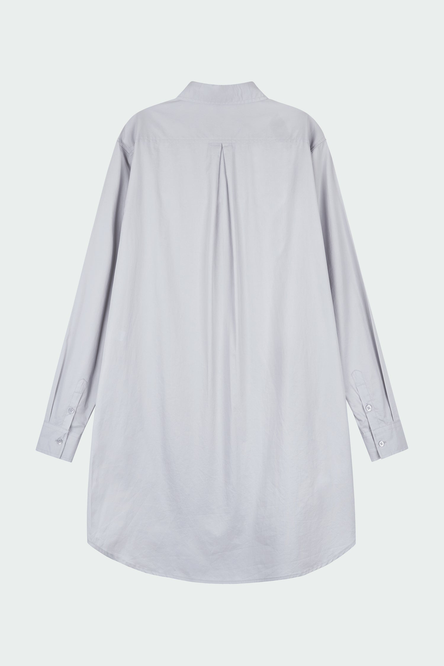 Cara Dress in cloud gray, long sleeve cotton shirt dress with front chest pocket, curved hem, hidden side pockets, and a relaxed silhouette.