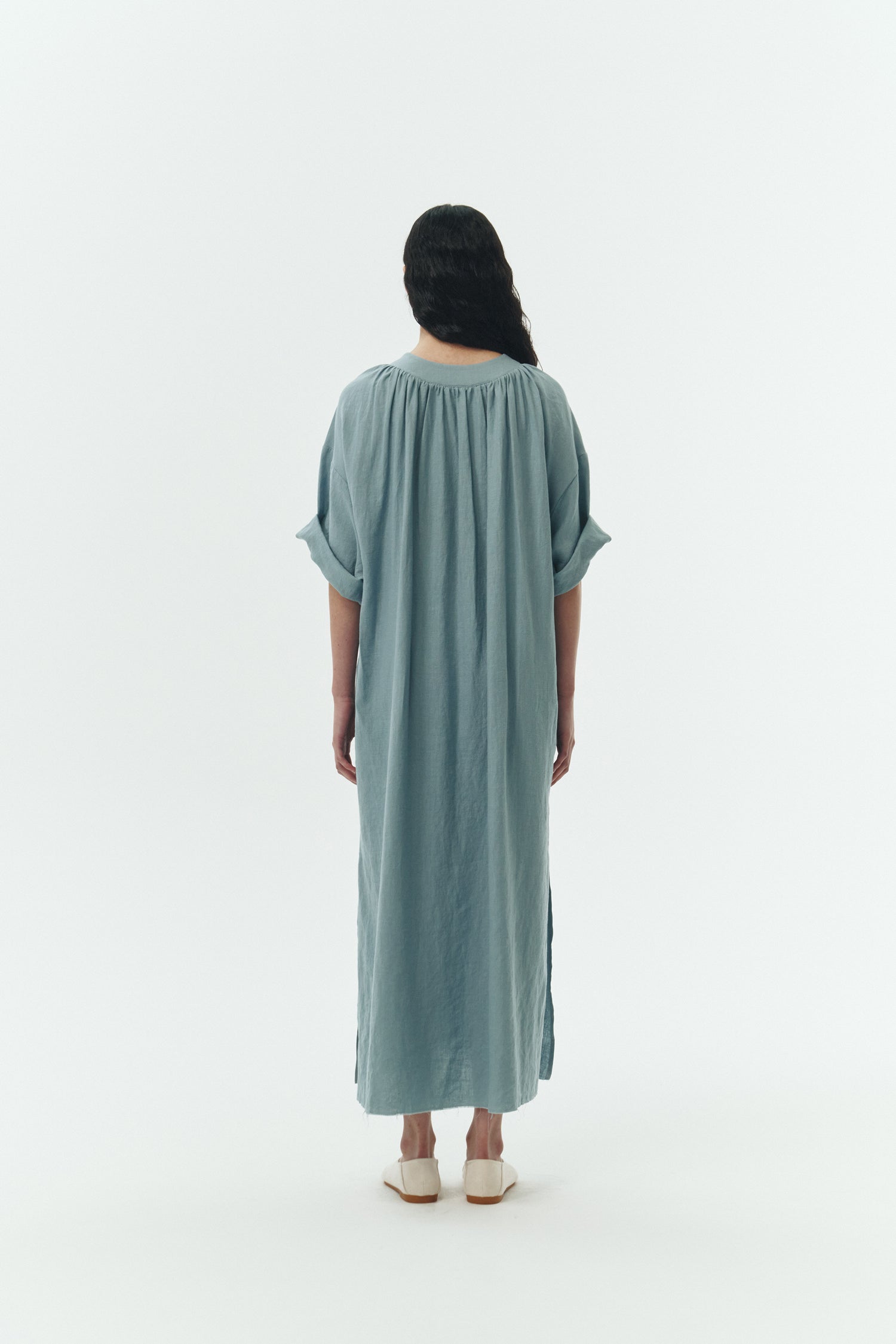 Charlotte Dress in light blue, V-neck summer maxi dress in a lightweight linen-rayon blend with drop shoulders, hidden side pockets, raw edge hem, and a relaxed fit.