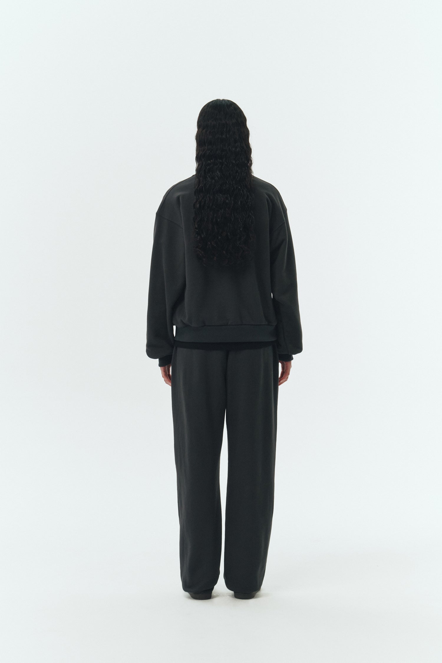 Willow Sweatshirt in ink black, a soft cotton French terry pullover with a crew neck, V-stitch detail, ribbed trims, and a relaxed fit, designed for everyday comfort