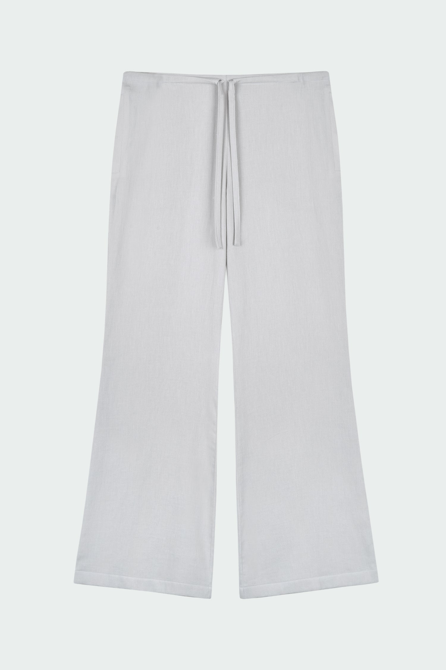 Chloe Pants in cloud gray, lightweight cotton pants with a drawstring waist, side pockets, and a flared bottom, relaxed fit for effortless everyday wear