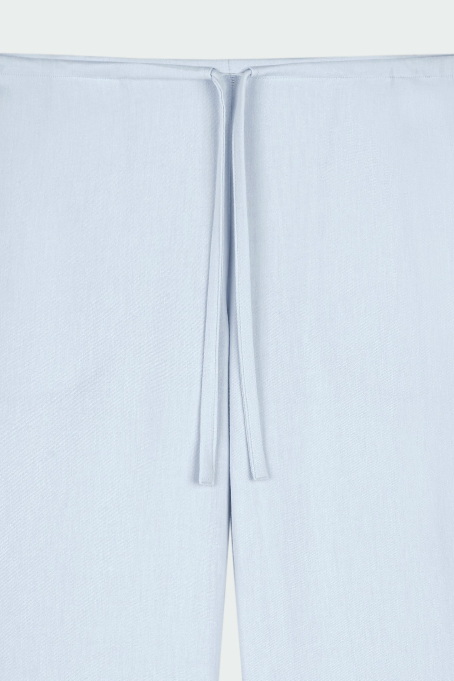 Chloe Pants in sky, lightweight cotton pants with a drawstring waist, side pockets, and a flared bottom, relaxed fit for effortless everyday wear