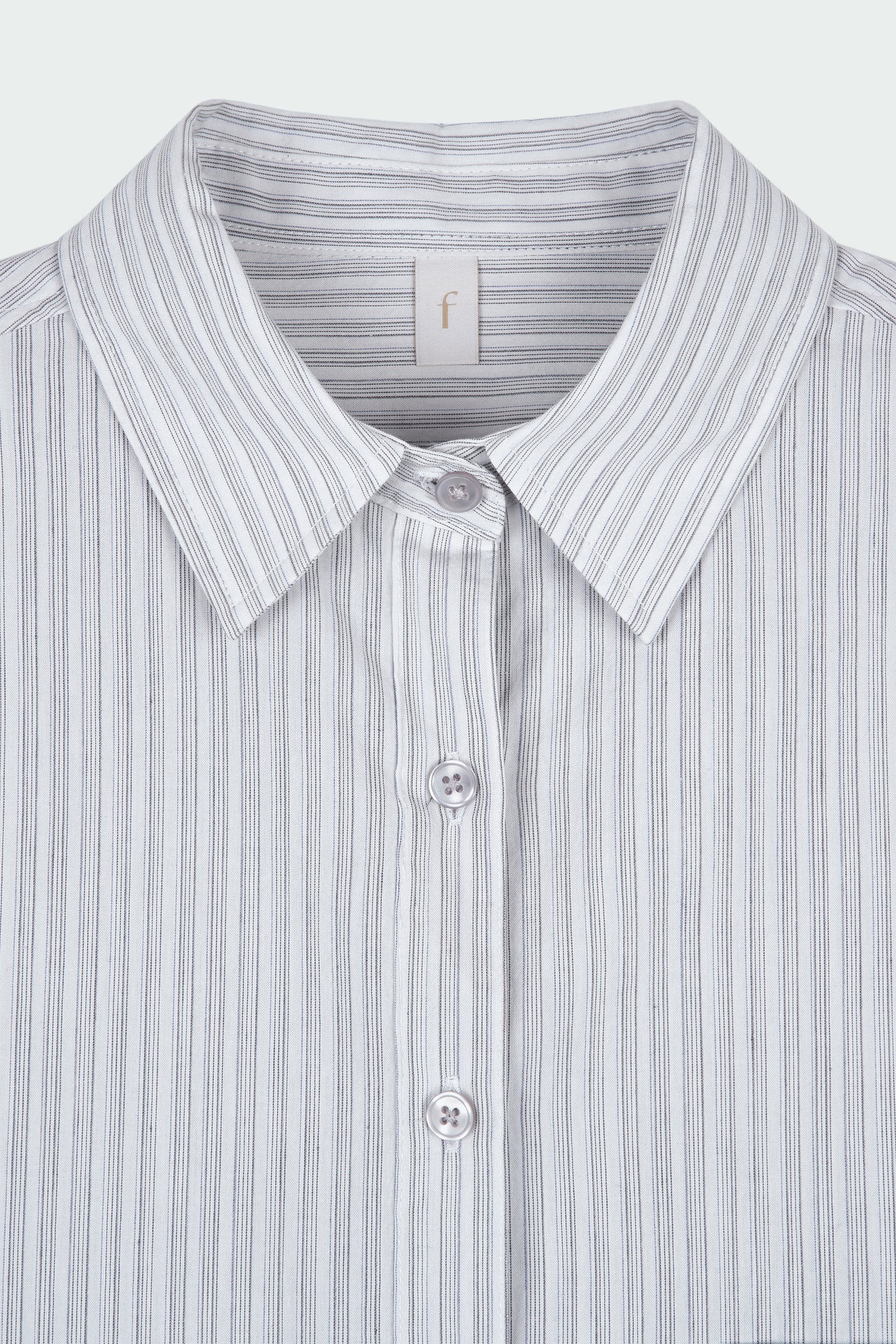 Isabella Shirt in stripe, a lightweight cotton-poly blend button-up with chest pocket, back pleat, and buttoned cuffs, designed in a regular fit with a hip-length silhouette