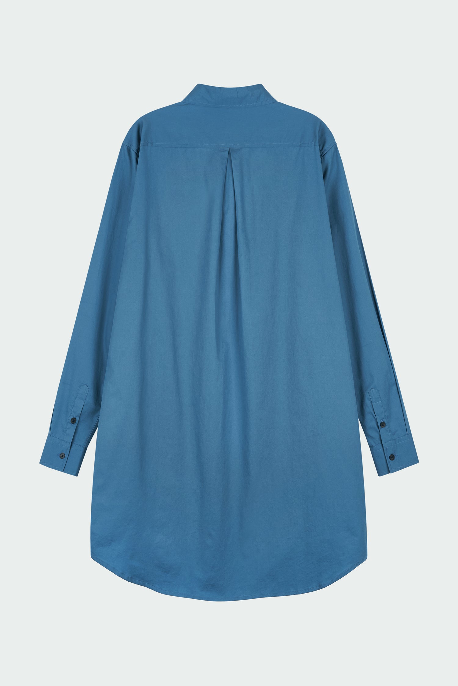 Cara Dress in blue green, long sleeve cotton shirt dress with front chest pocket, curved hem, hidden side pockets, and a relaxed silhouette.