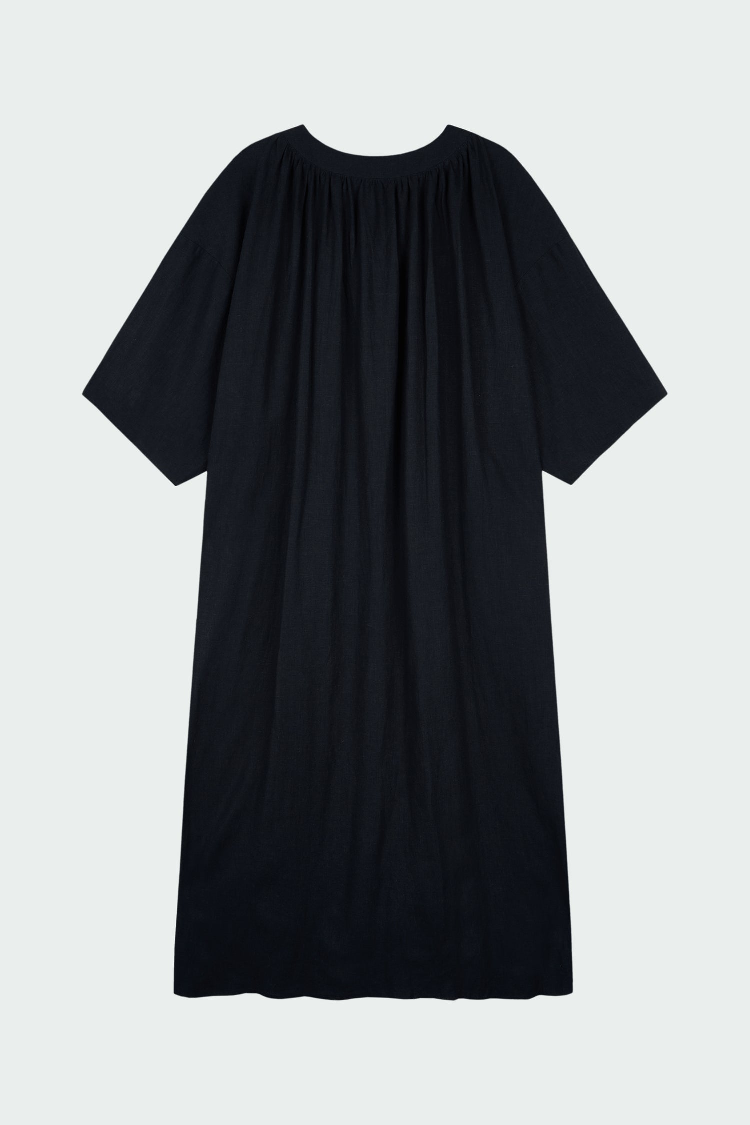 Charlotte Dress in navy, V-neck summer maxi dress in a lightweight linen-rayon blend with drop shoulders, hidden side pockets, raw edge hem, and a relaxed fit.