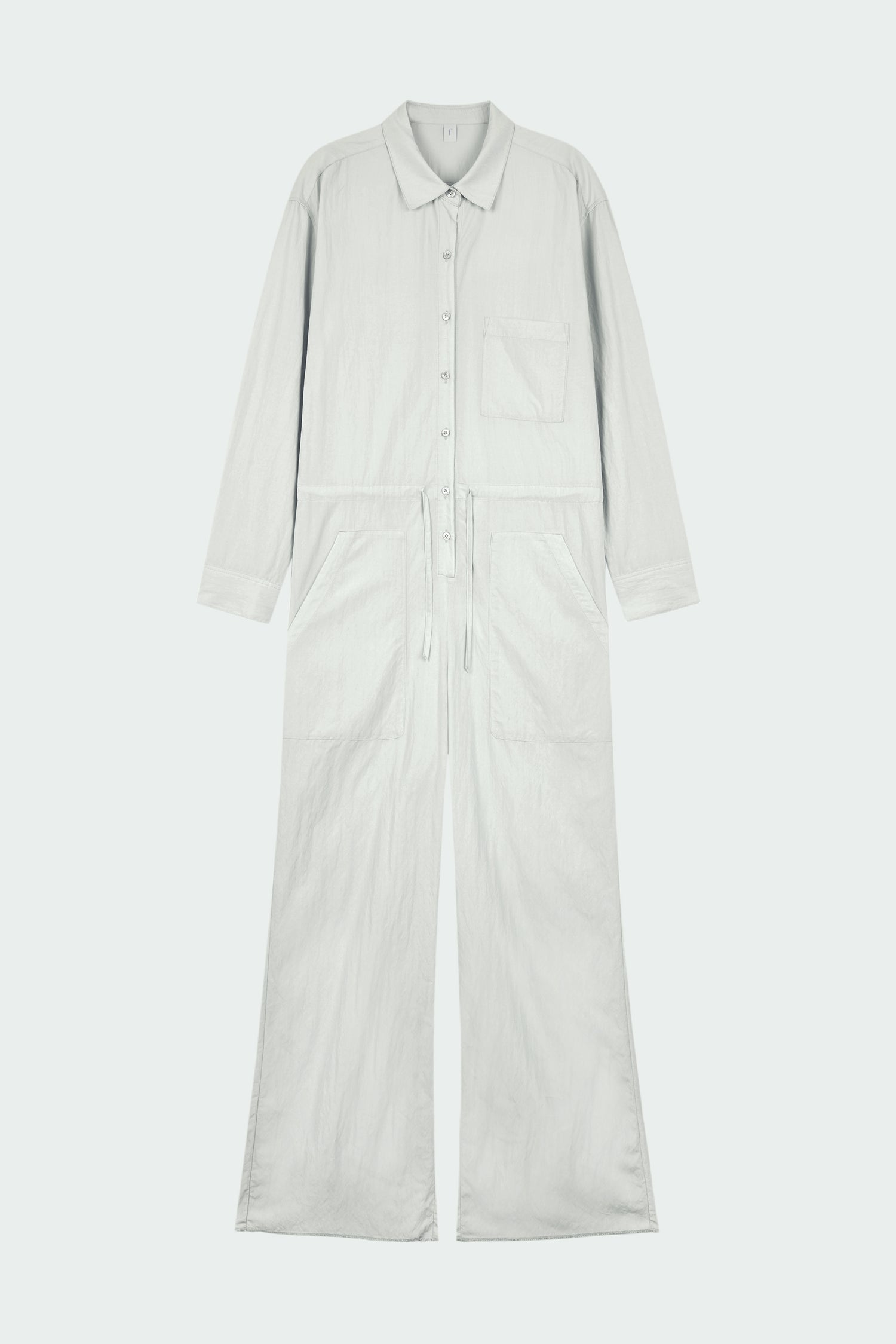 Saige Jumpsuit in cloud, long-sleeve rayon blend jumpsuit with point collar, front button closure, drawstring waist, and patch pockets.