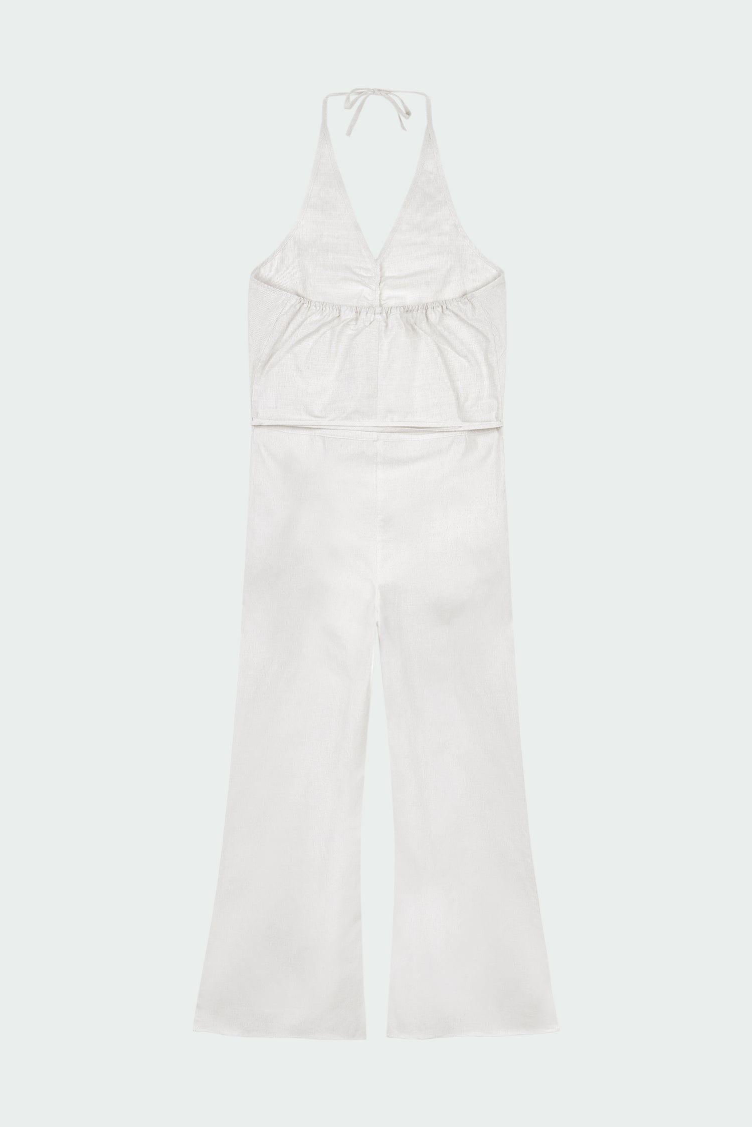 Daisy Jumpsuit in stripe, sleeveless linen blend jumpsuit with adjustable halterneck, open back, straight-leg silhouette, and relaxed fit.
