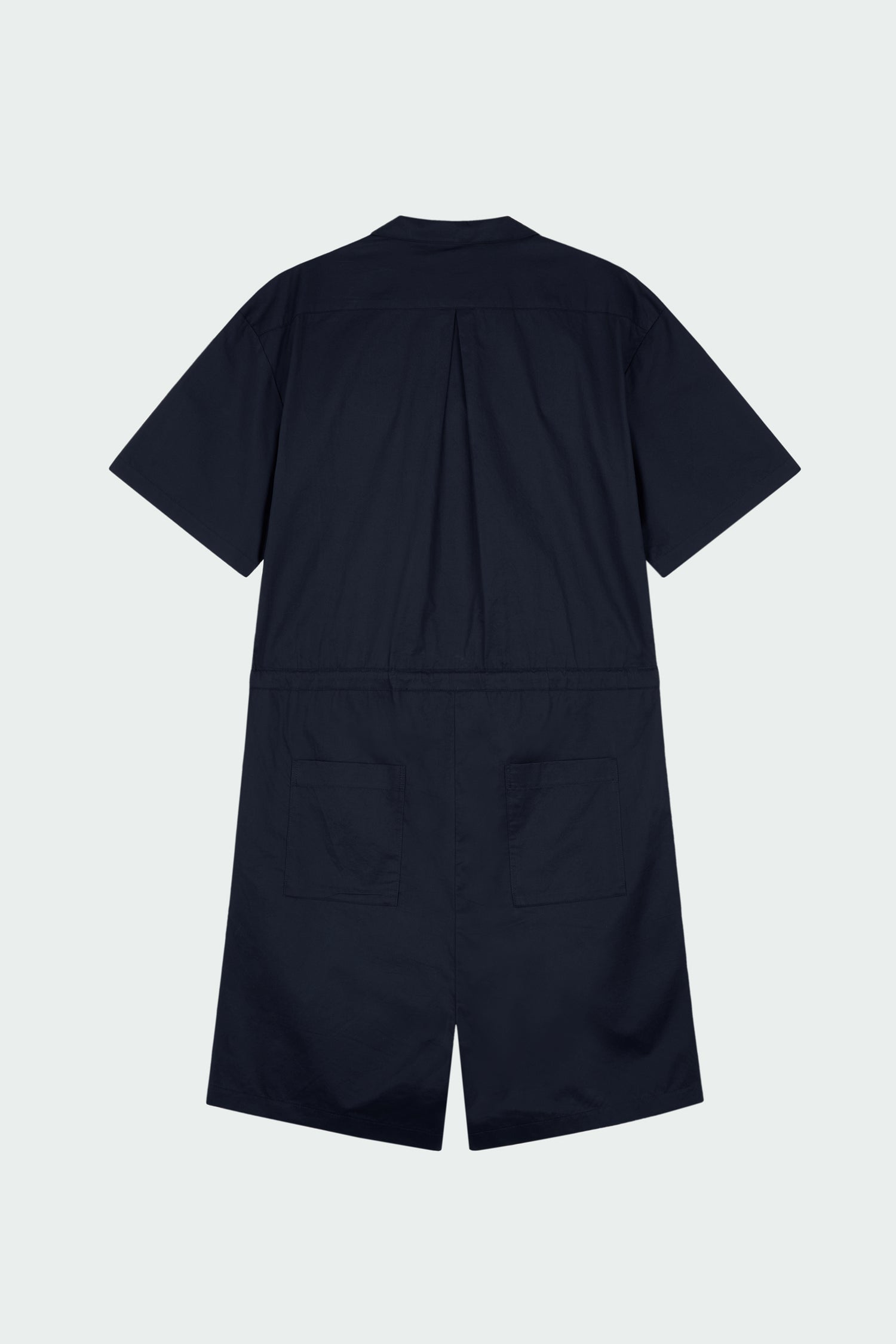 Emma Jumpsuit in navy, short-sleeve cotton jumpsuit with camp collar, front buttons, drawstring waist, and multiple pockets.