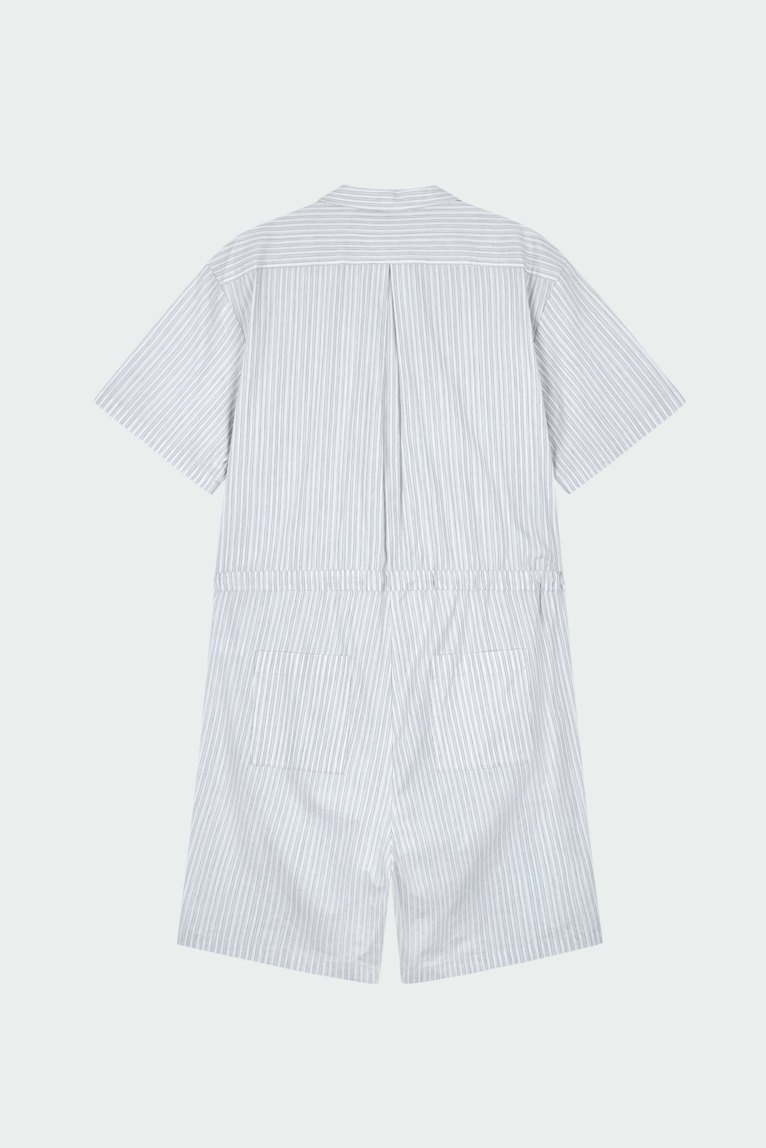 Emma Jumpsuit in stripe, short-sleeve cotton jumpsuit with camp collar, front buttons, drawstring waist, and multiple pockets.