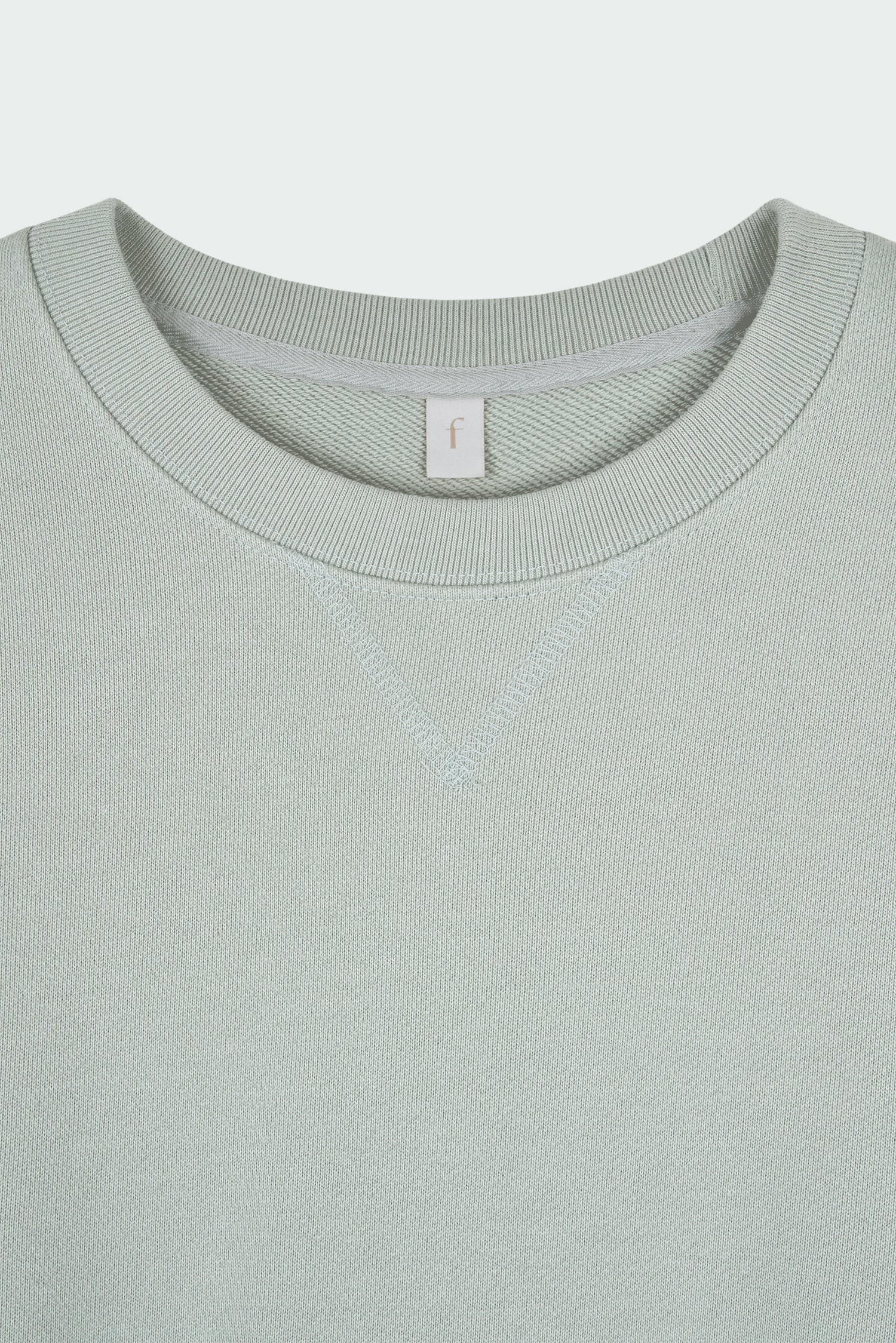 Willow Sweatshirt in pistachio, a soft cotton French terry pullover with a crew neck, V-stitch detail, ribbed trims, and a relaxed fit, designed for everyday comfort
