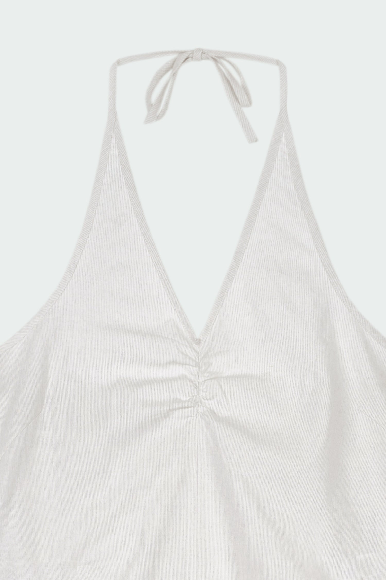Daisy Jumpsuit in stripe, sleeveless linen blend jumpsuit with adjustable halterneck, open back, straight-leg silhouette, and relaxed fit.