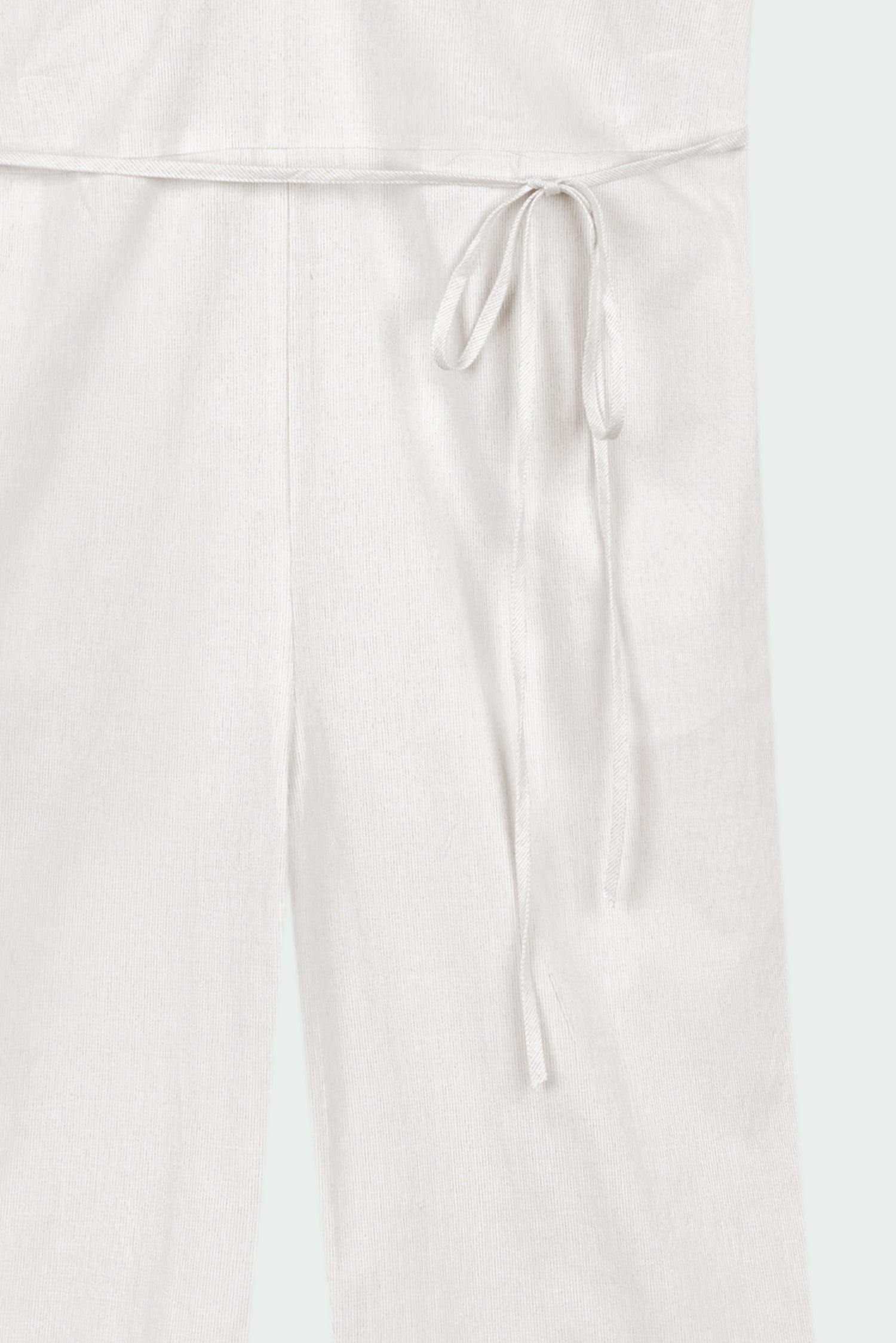 Daisy Jumpsuit in stripe, sleeveless linen blend jumpsuit with adjustable halterneck, open back, straight-leg silhouette, and relaxed fit.