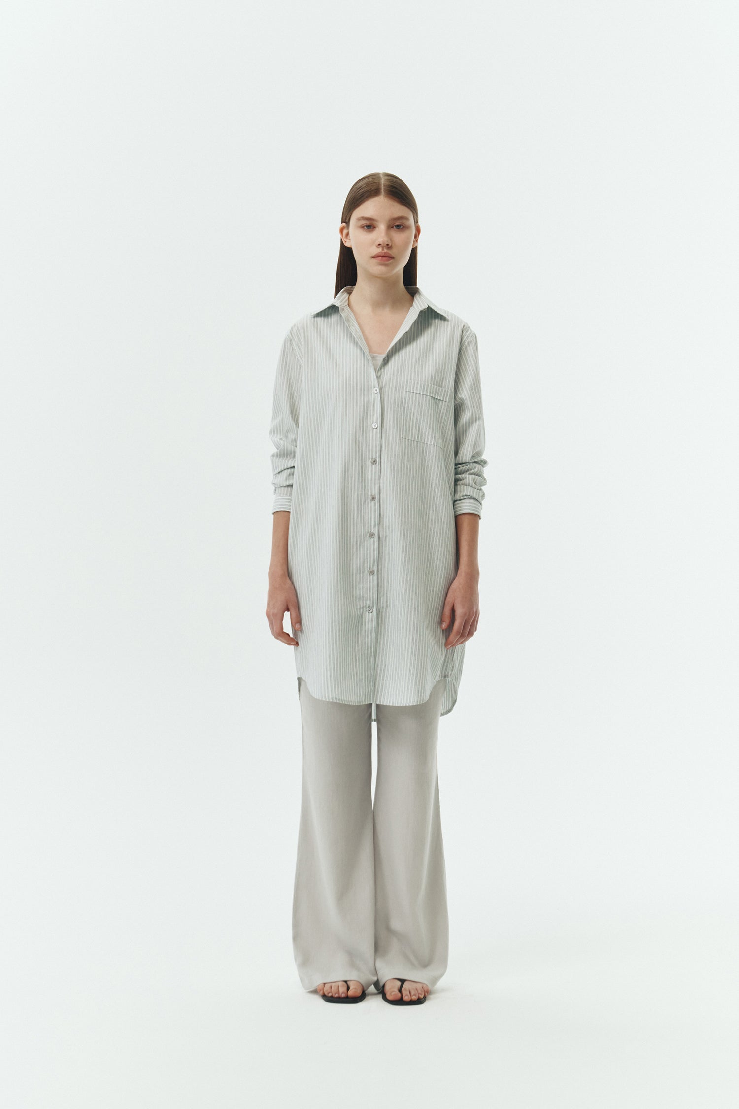 Cara Dress in stripe, long sleeve cotton shirt dress with front chest pocket, curved hem, hidden side pockets, and a relaxed silhouette.