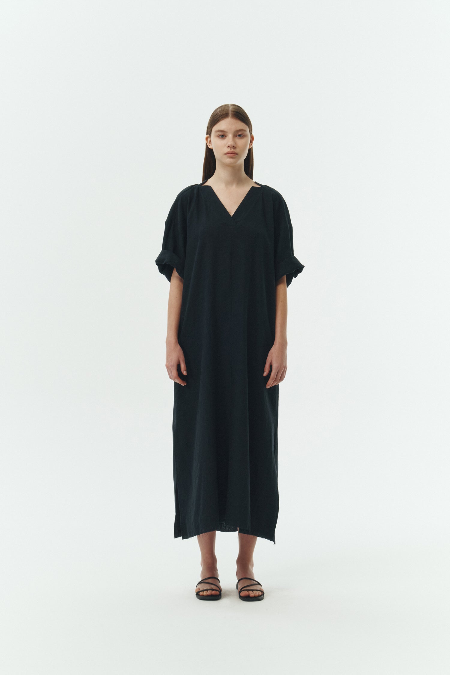 Charlotte Dress in navy, V-neck summer maxi dress in a lightweight linen-rayon blend with drop shoulders, hidden side pockets, raw edge hem, and a relaxed fit.
