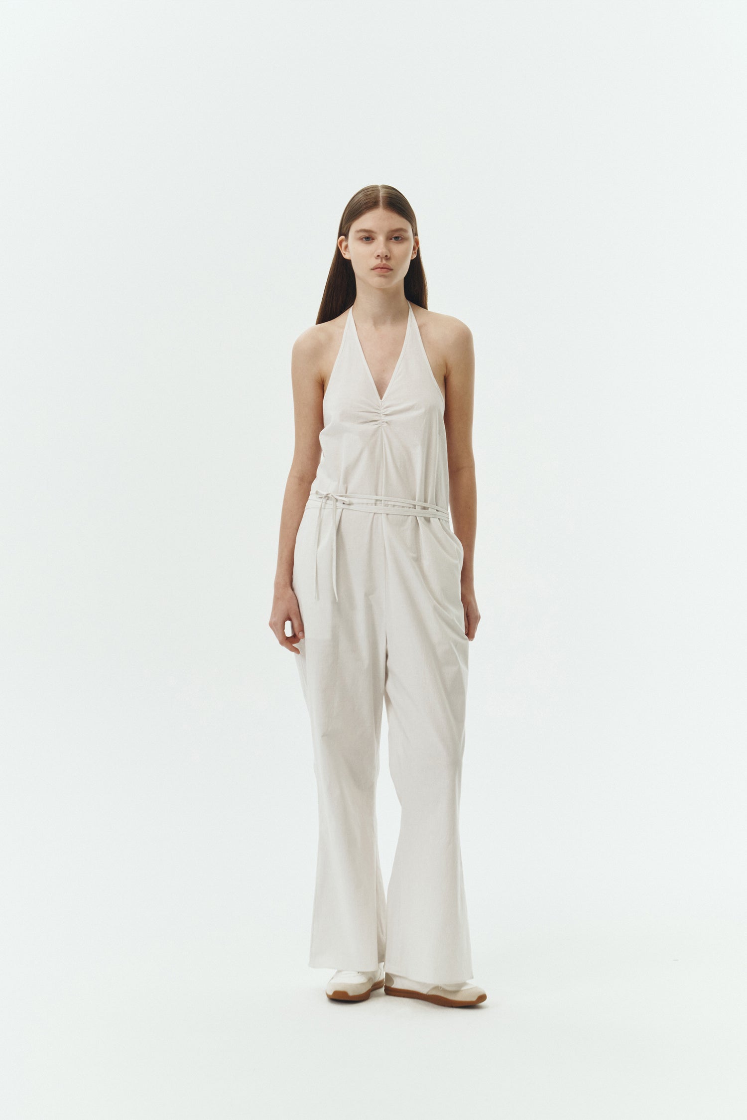 Daisy Jumpsuit in stripe, sleeveless linen blend jumpsuit with adjustable halterneck, open back, straight-leg silhouette, and relaxed fit.
