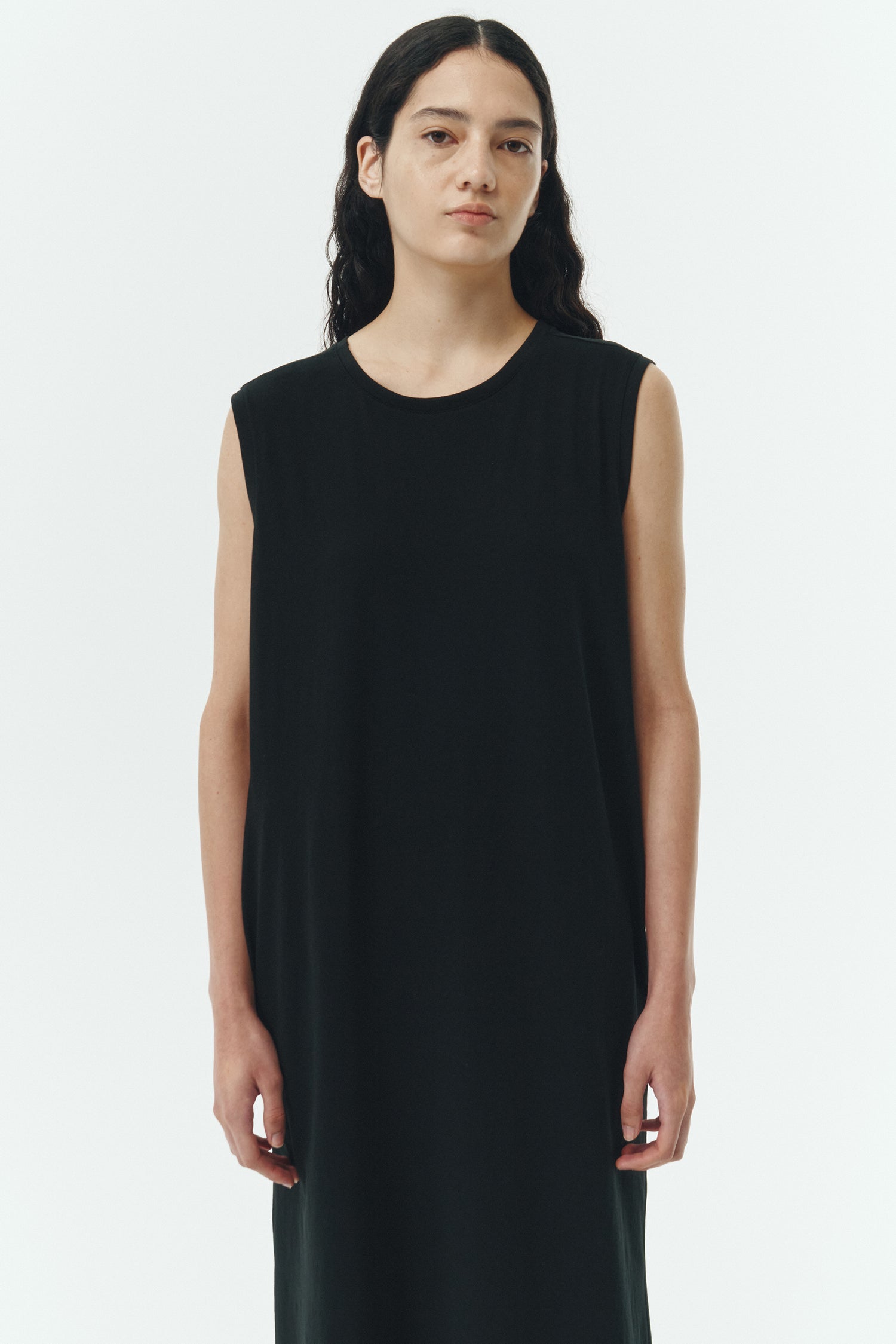 Jade Dress in black, a sleeveless knit cotton midi dress with side pockets, designed for breathable summer comfort