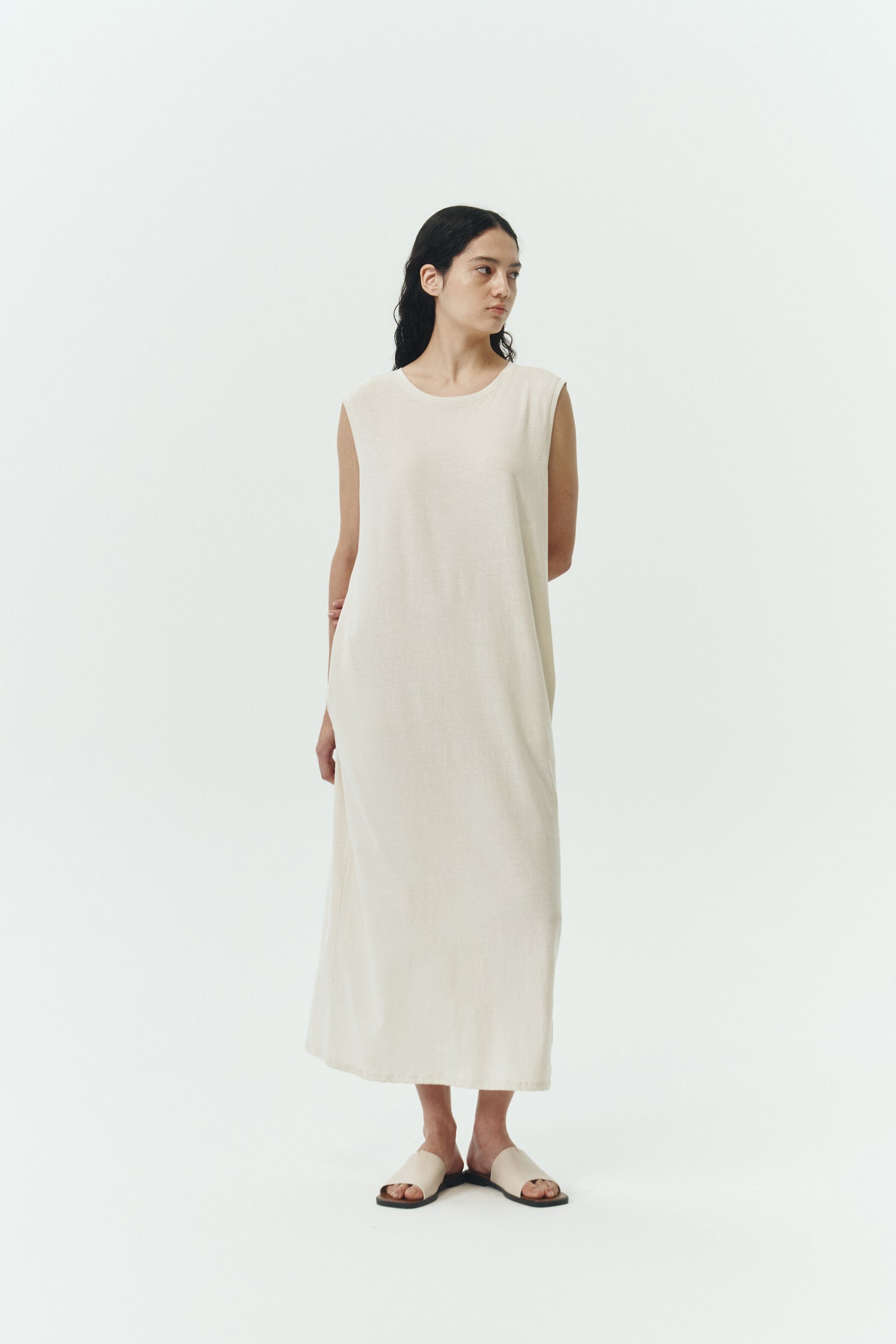 Jade Dress in cream, a sleeveless knit cotton midi dress with side pockets, designed for breathable summer comfort