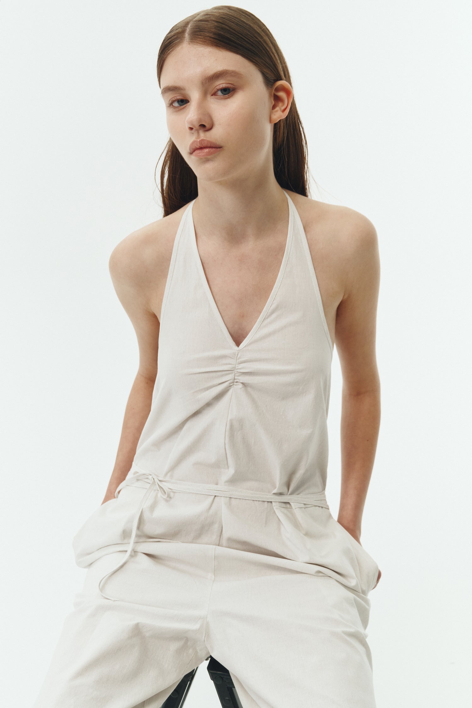 Daisy Jumpsuit in stripe, sleeveless linen blend jumpsuit with adjustable halterneck, open back, straight-leg silhouette, and relaxed fit.