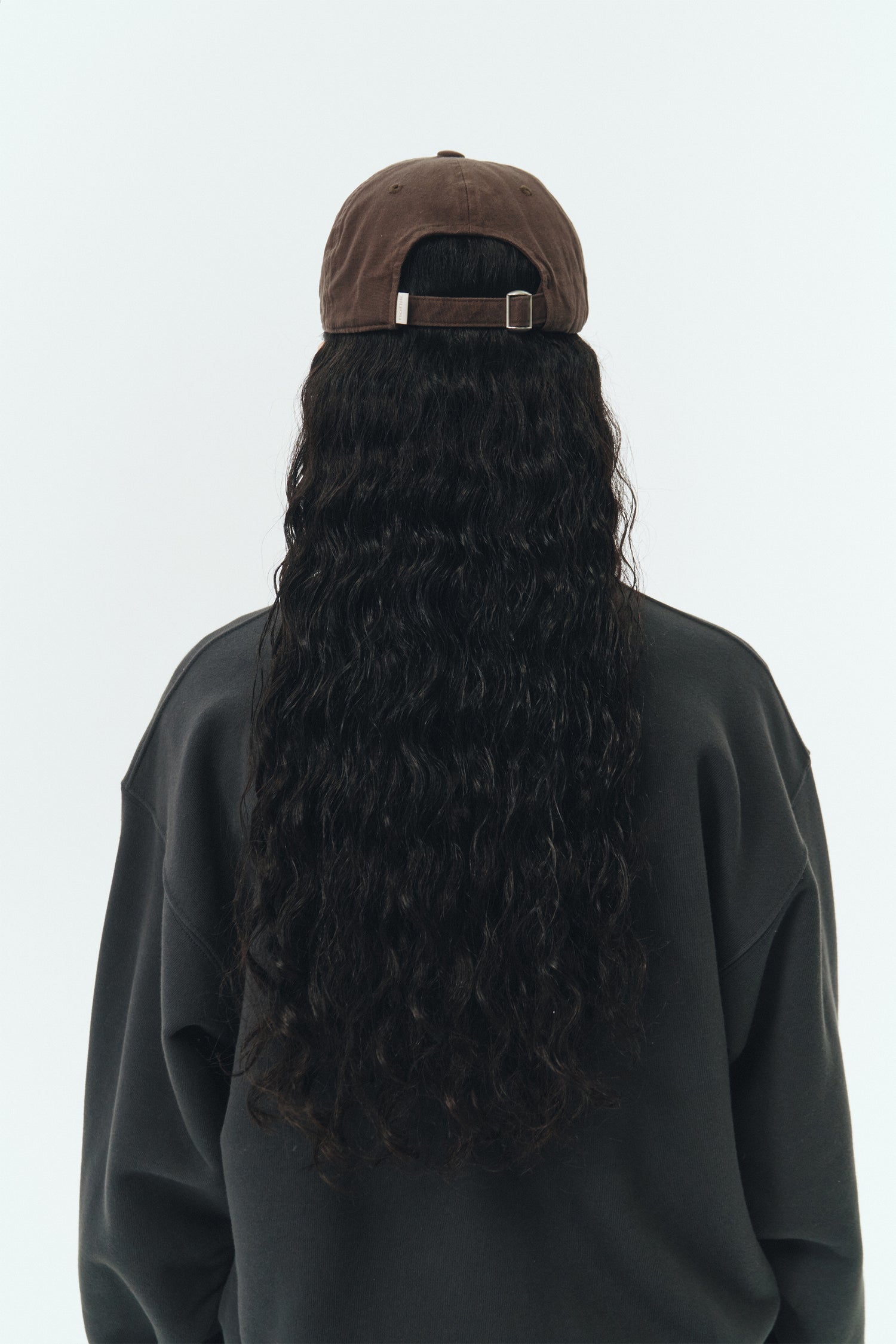 Steva Oxford Cap in brown, made from soft washed cotton with a front embroidered logo and adjustable buckle strap, designed for a casual everyday look