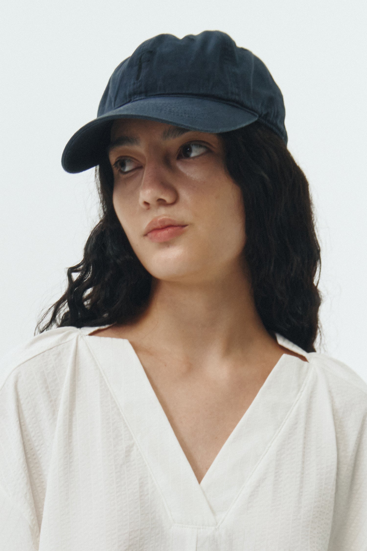 Steva Oxford Cap in navy, made from soft washed cotton with a front embroidered logo and adjustable buckle strap, designed for a casual everyday look