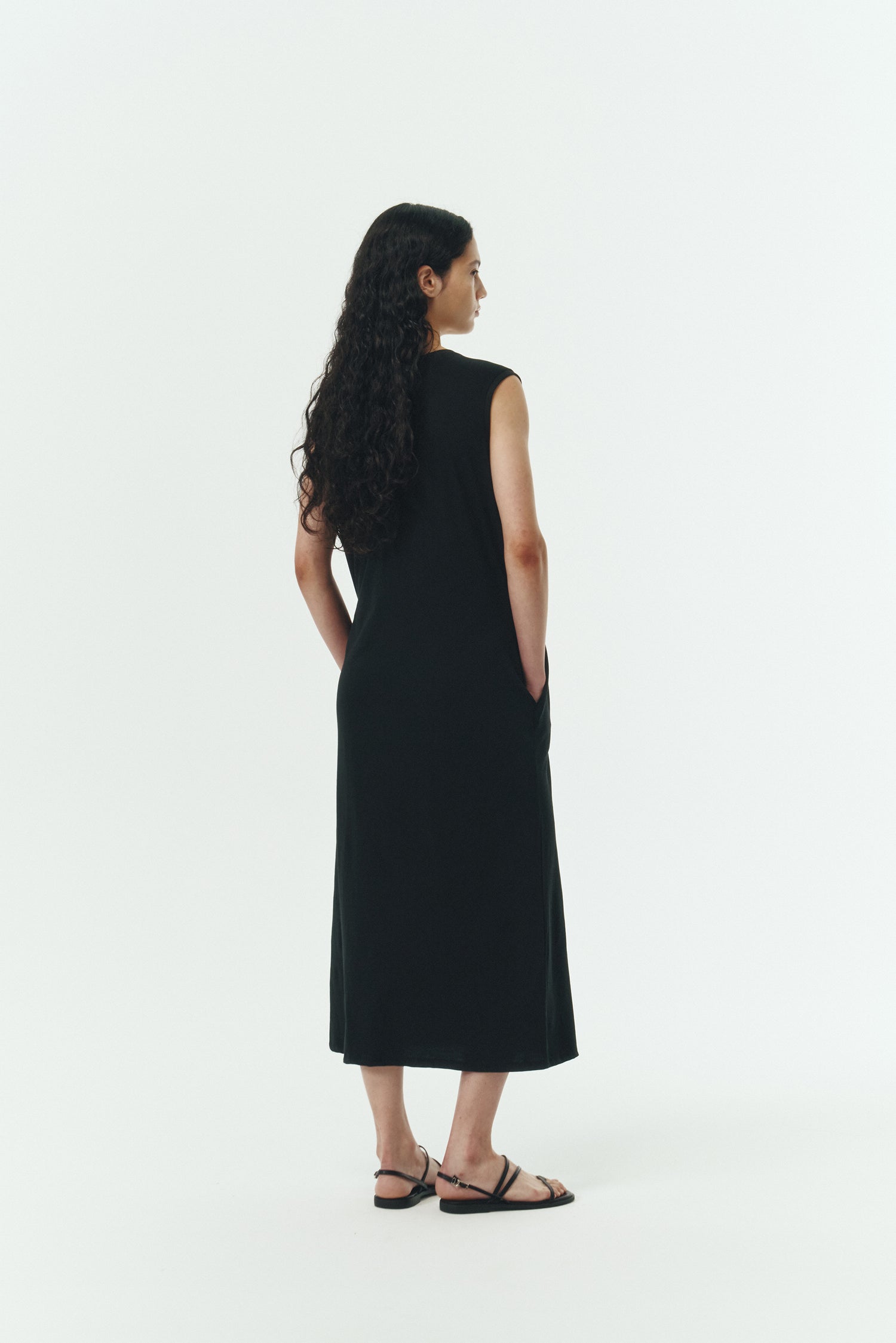 Jade Dress in black, a sleeveless knit cotton midi dress with side pockets, designed for breathable summer comfort