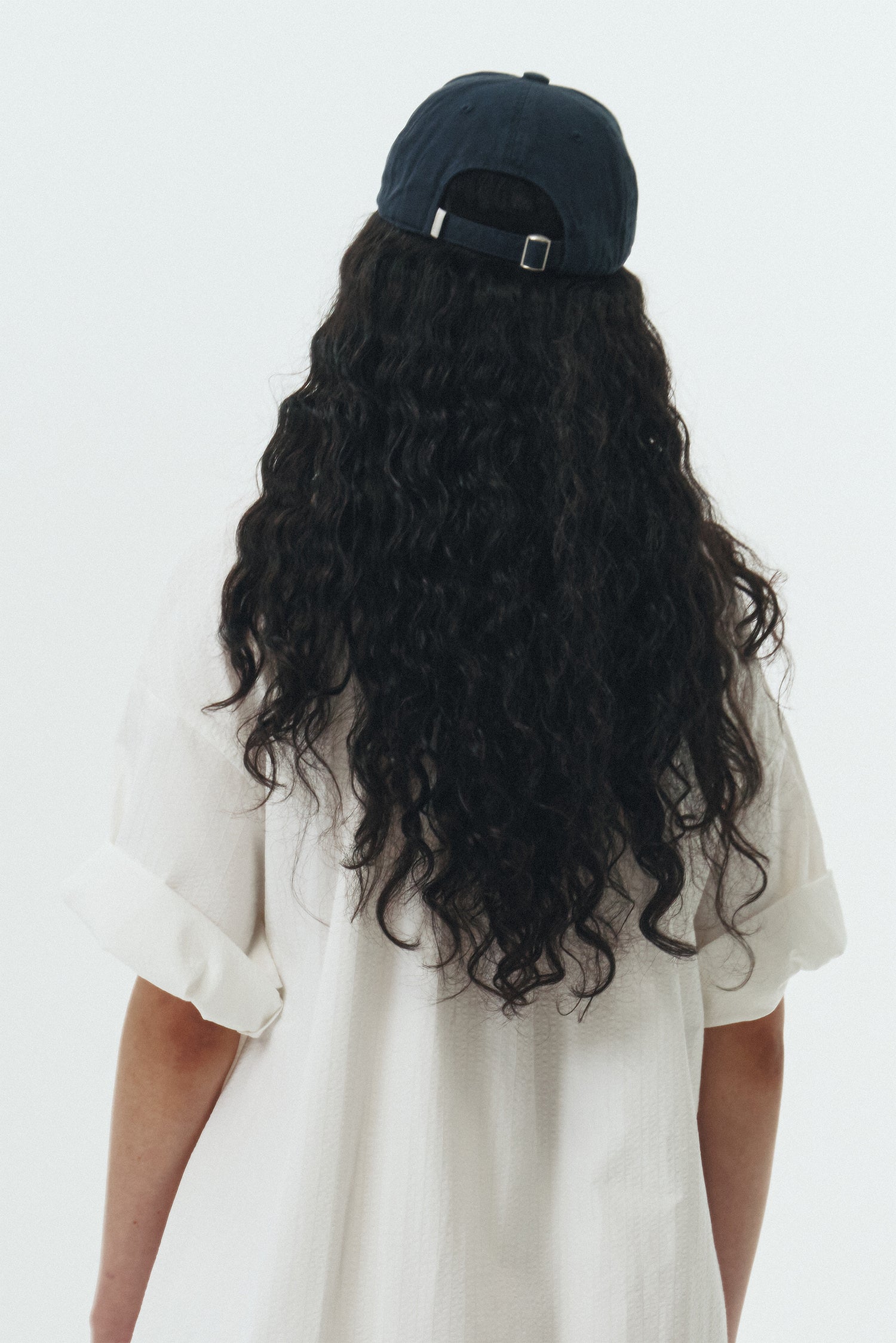 Steva Oxford Cap in navy, made from soft washed cotton with a front embroidered logo and adjustable buckle strap, designed for a casual everyday look
