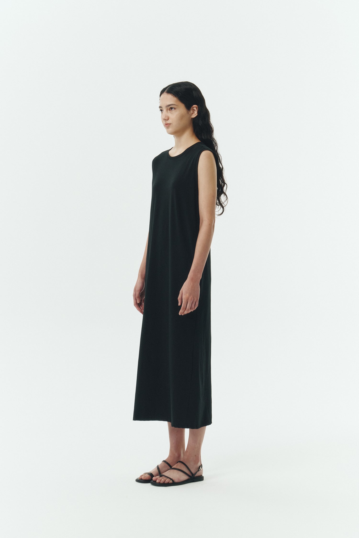 Jade Dress in black, a sleeveless knit cotton midi dress with side pockets, designed for breathable summer comfort