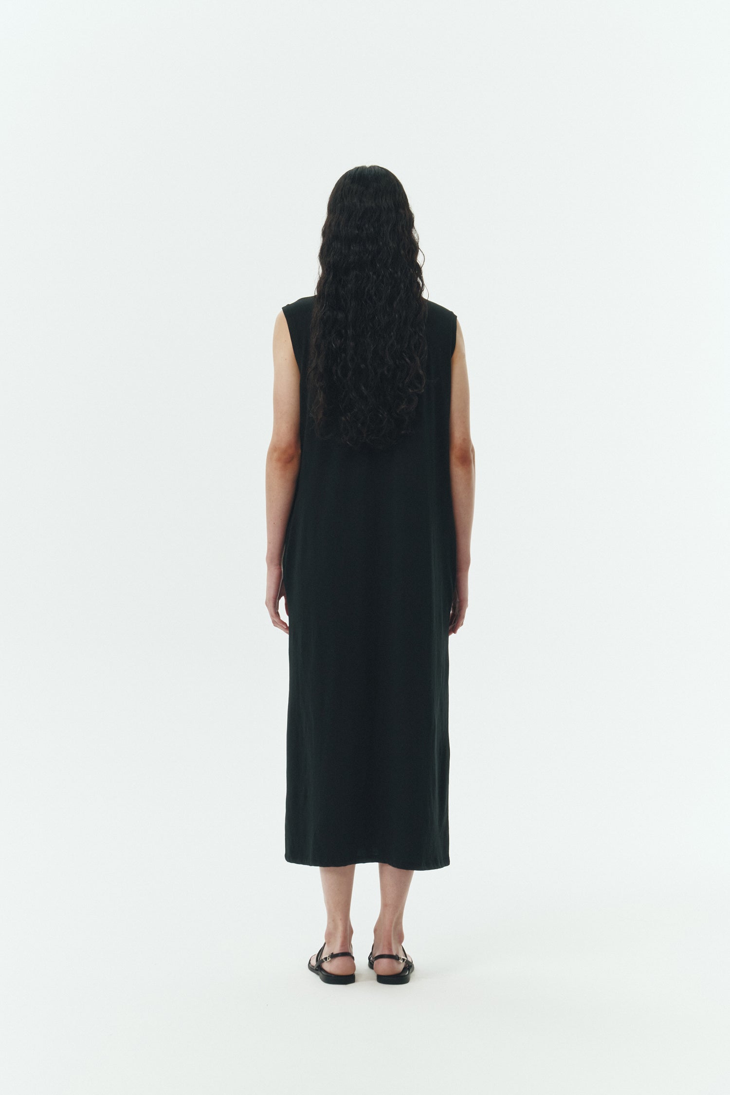Jade Dress in black, a sleeveless knit cotton midi dress with side pockets, designed for breathable summer comfort
