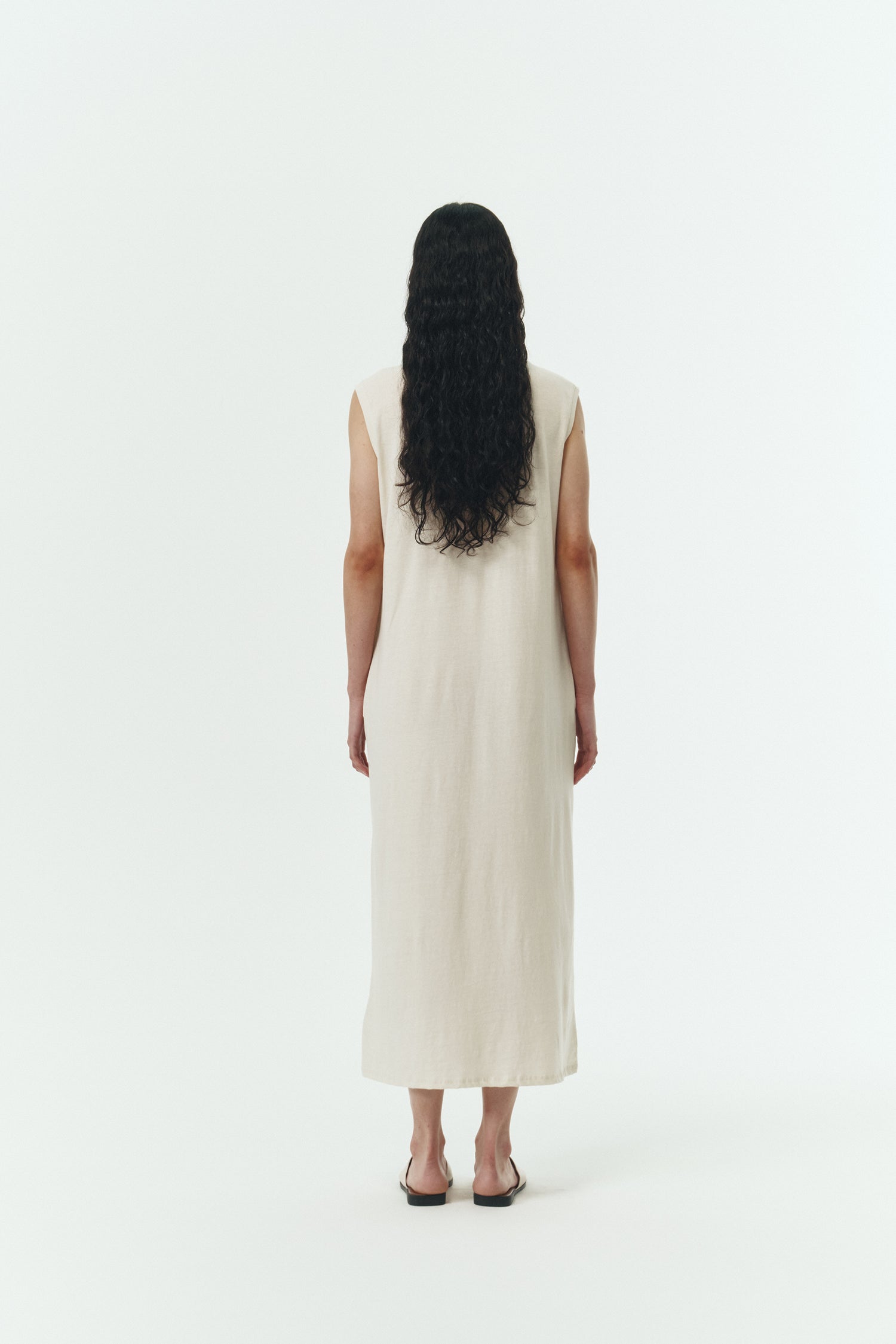 Jade Dress in cream, a sleeveless knit cotton midi dress with side pockets, designed for breathable summer comfort