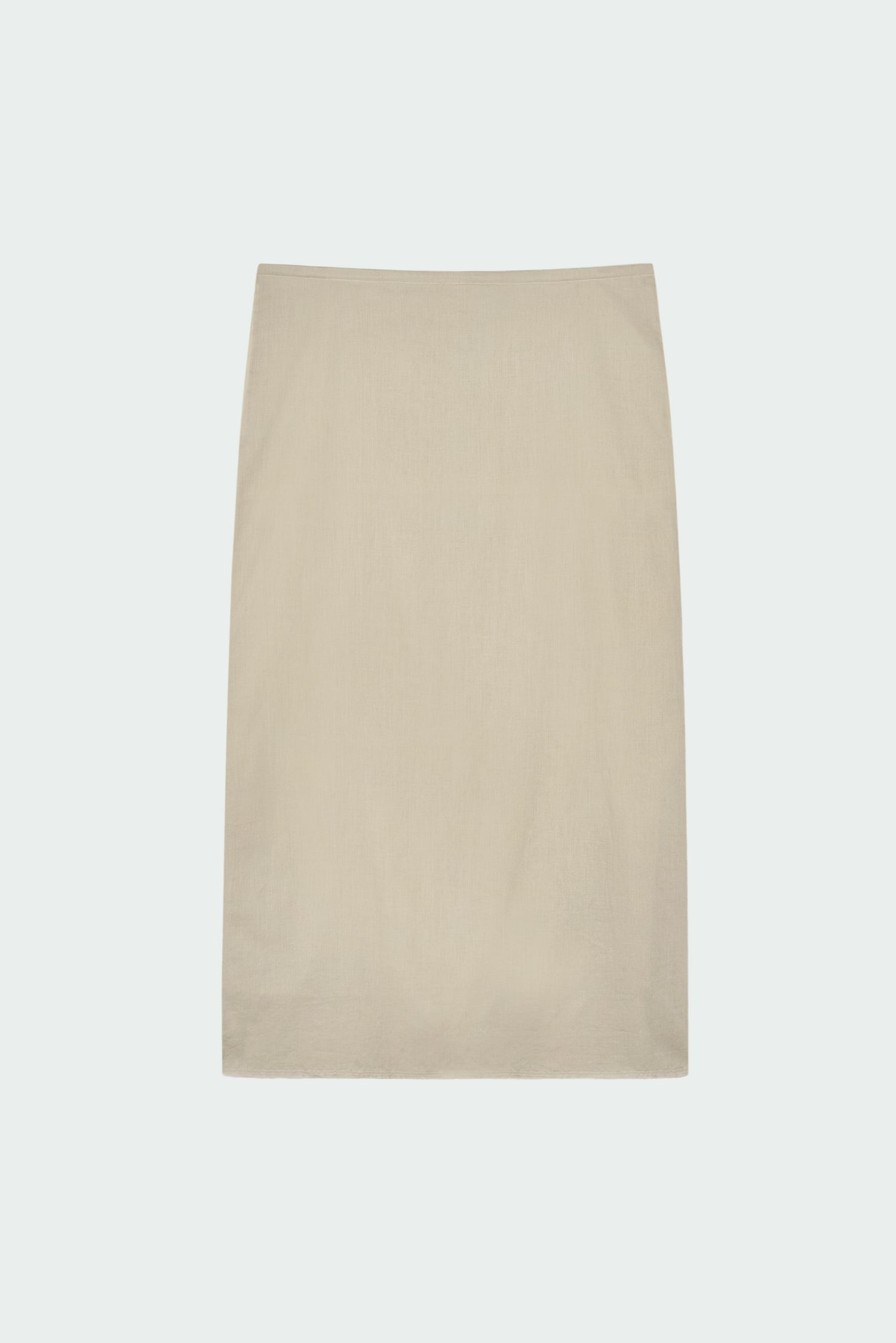 Amelia Skirt in sand, a lightweight cotton midi skirt with inner drawstring waist, hidden side pockets, lined layers, raw-edge hem, and a center back slit for ease and movement