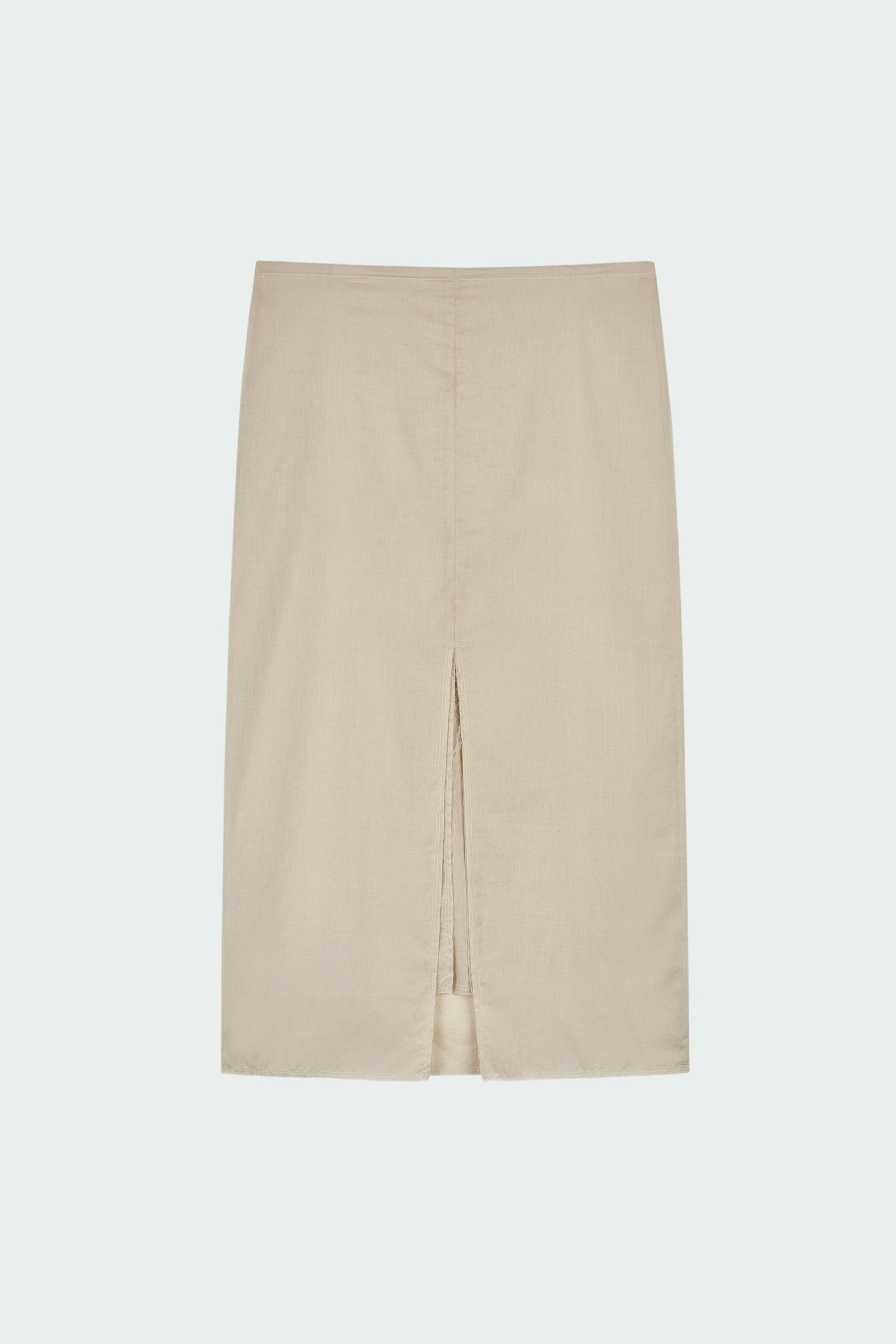 Amelia Skirt in sand, a lightweight cotton midi skirt with inner drawstring waist, hidden side pockets, lined layers, raw-edge hem, and a center back slit for ease and movement