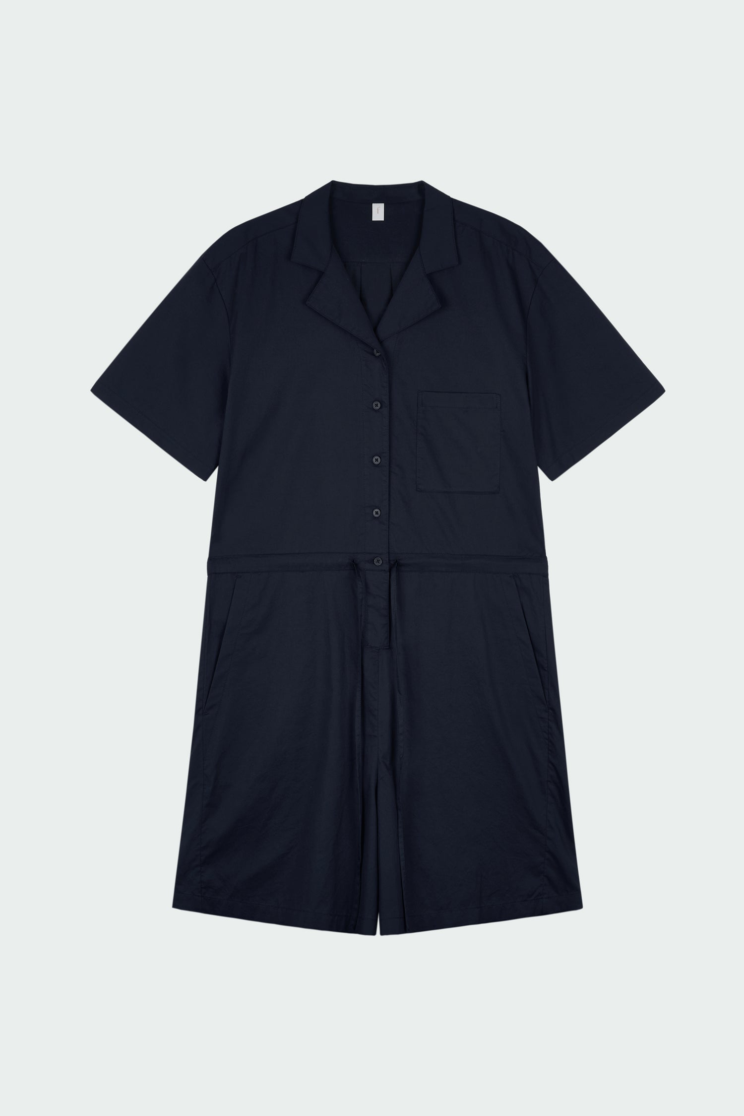 Emma Jumpsuit in navy, short-sleeve cotton jumpsuit with camp collar, front buttons, drawstring waist, and multiple pockets.