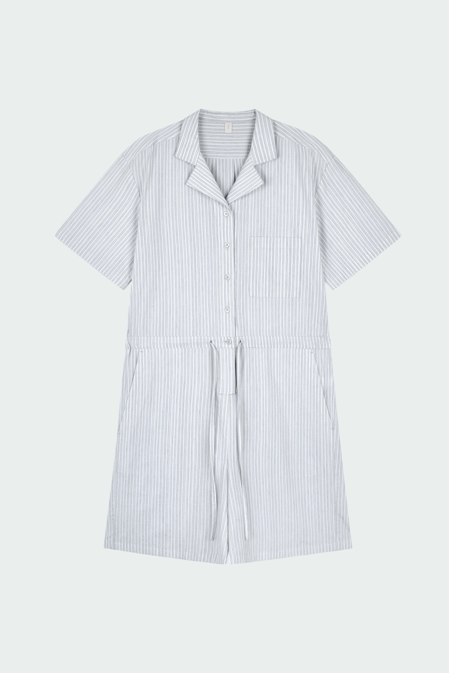 Emma Jumpsuit in stripe, short-sleeve cotton jumpsuit with camp collar, front buttons, drawstring waist, and multiple pockets.