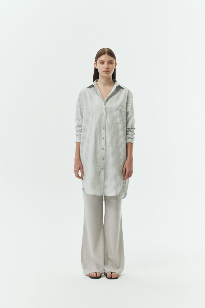 Cara Dress in stripe, long sleeve cotton shirt dress with front chest pocket, curved hem, hidden side pockets, and a relaxed silhouette.