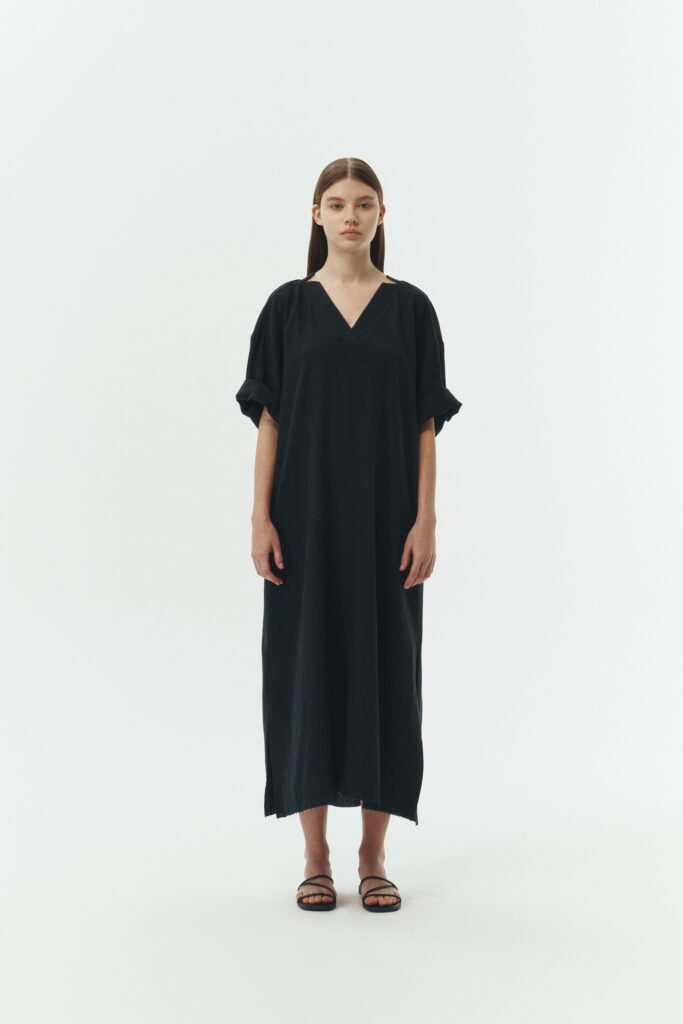 Charlotte Dress in navy, V-neck summer maxi dress in a lightweight linen-rayon blend with drop shoulders, hidden side pockets, raw edge hem, and a relaxed fit.