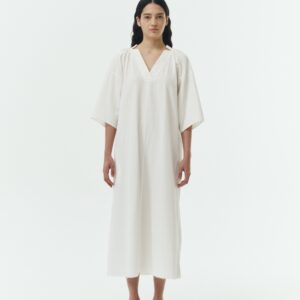 Charlotte Dress in white stripe, V-neck summer maxi dress in a lightweight linen-rayon blend with drop shoulders, hidden side pockets, raw edge hem, and a relaxed fit.