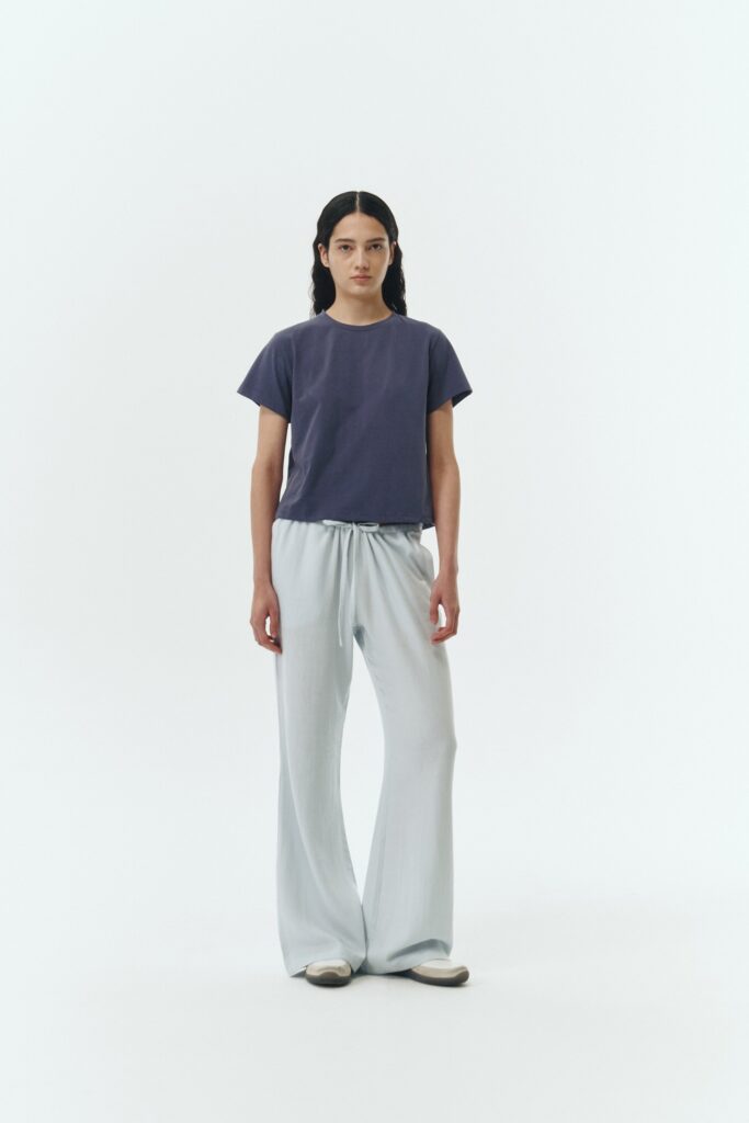 Chloe Pants in sky, lightweight cotton pants with a drawstring waist, side pockets, and a flared bottom, relaxed fit for effortless everyday wear