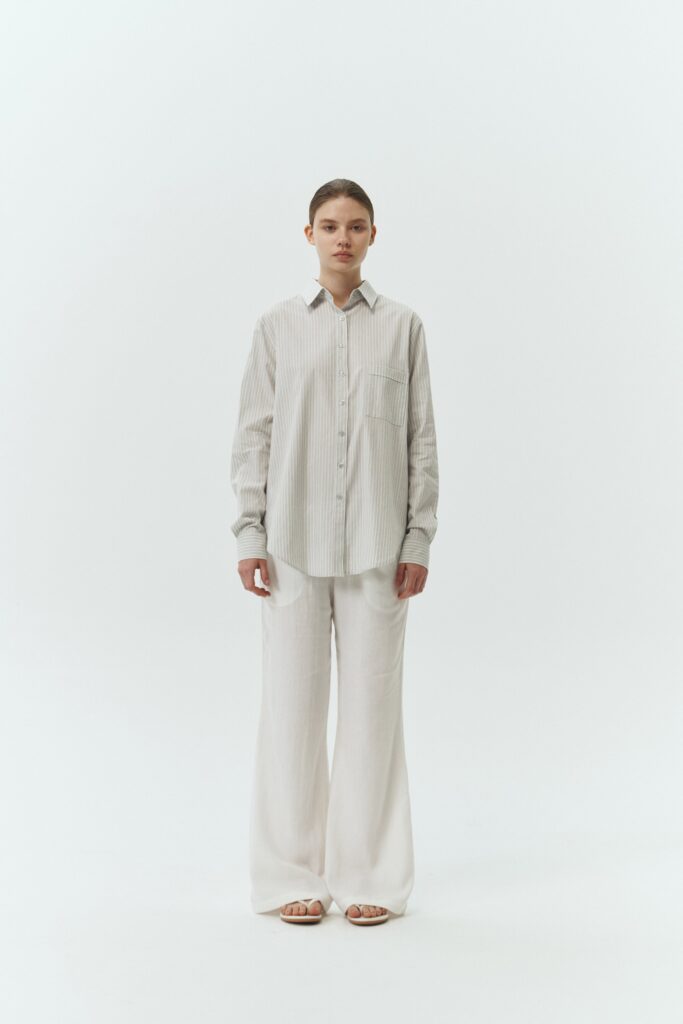 Chloe Pants in off white, lightweight cotton pants with a drawstring waist, side pockets, and a flared bottom, relaxed fit for effortless everyday wear