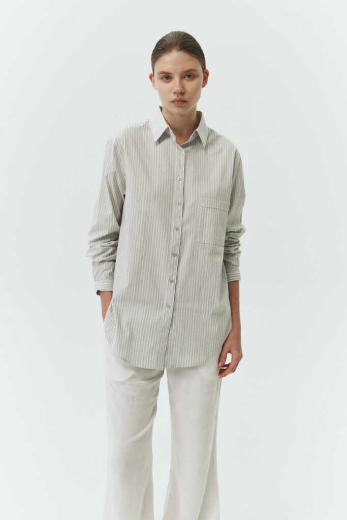 Isabella Shirt in stripe, a lightweight cotton-poly blend button-up with chest pocket, back pleat, and buttoned cuffs, designed in a regular fit with a hip-length silhouette