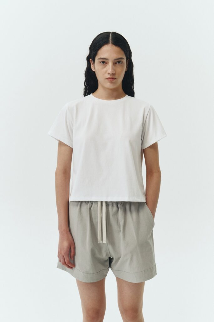 Ivy T-shirt in white, cropped short-sleeve tee in a lightweight cotton-poly blend with crew neck, regular fit, and clean silhouette.