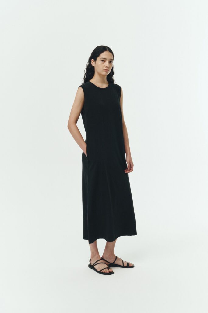 Jade Dress in black, a sleeveless knit cotton midi dress with side pockets, designed for breathable summer comfort