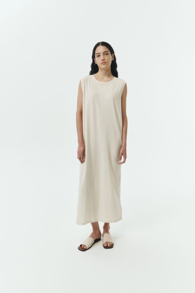 Jade Dress in cream, a sleeveless knit cotton midi dress with side pockets, designed for breathable summer comfort